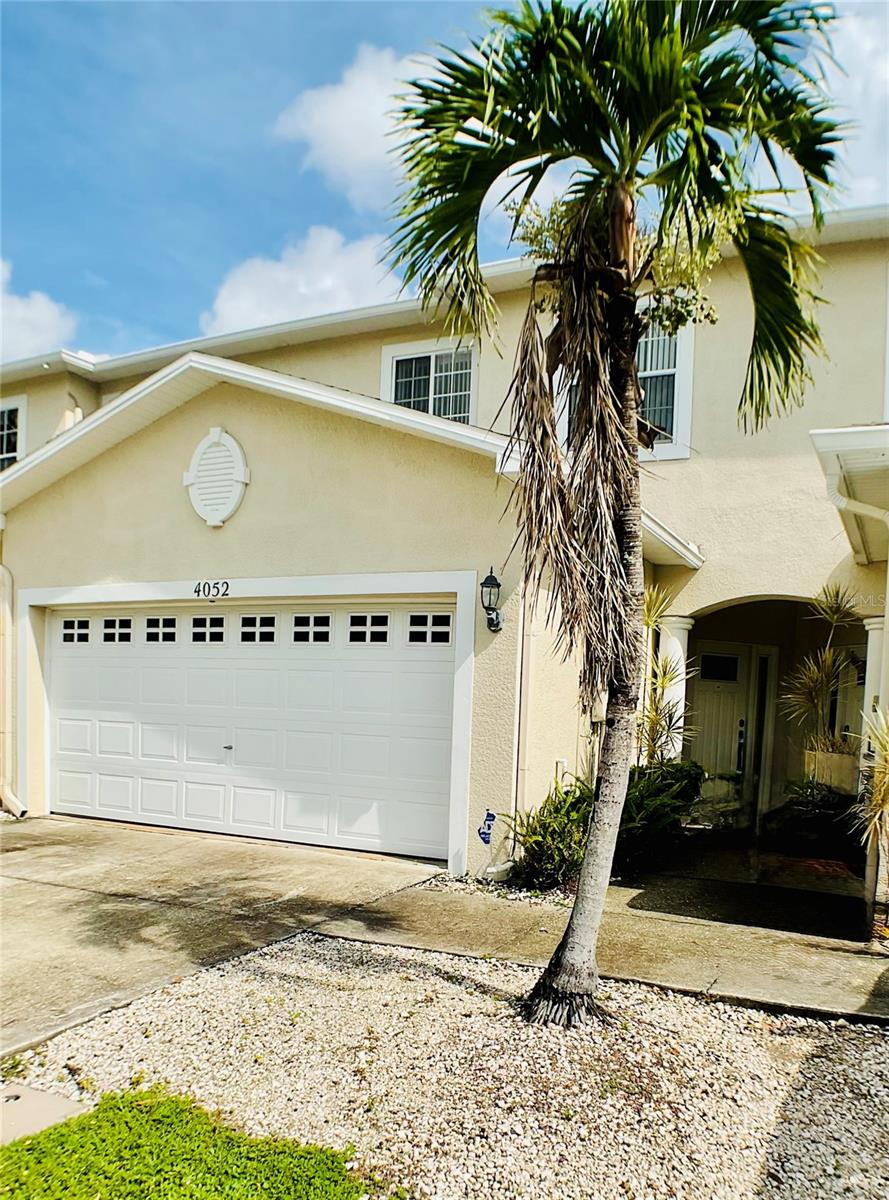 This move in ready 3 bedroom, 2.5 bath townhome is tucked away on a peaceful cul-de-sac in the desirable Meadows at Largo community. Step inside to an open living and dining area with high ceilings and new plank flooring, creating a bright, airy feel. With spacious closets and plenty of cabinets, this home makes it easy to stay organized while enjoying comfortable living. The kitchen is designed for both function and style, featuring crisp white cabinetry, matching appliances, two pantries for extra storage, and a breakfast bar for casual dining or quick meals. An adjacent full laundry room comes equipped with a washer and dryer for your convenience. Upstairs, you'll find all the bedrooms with soft carpet flooring. The oversized primary suite is a true retreat with space for a sitting area, and a spa-like en suite bath with dual sinks, soaking tub, and a large walk in shower. This beautiful home also offers a private, fenced courtyard and covered patio that is ideal for morning coffee, evening gatherings, or simply relaxing outdoors. Enjoy the unbeatable location that is minutes away from shopping, restaurants, entertainment, and everyday conveniences. Don't miss the chance to make this your new home - apply today!