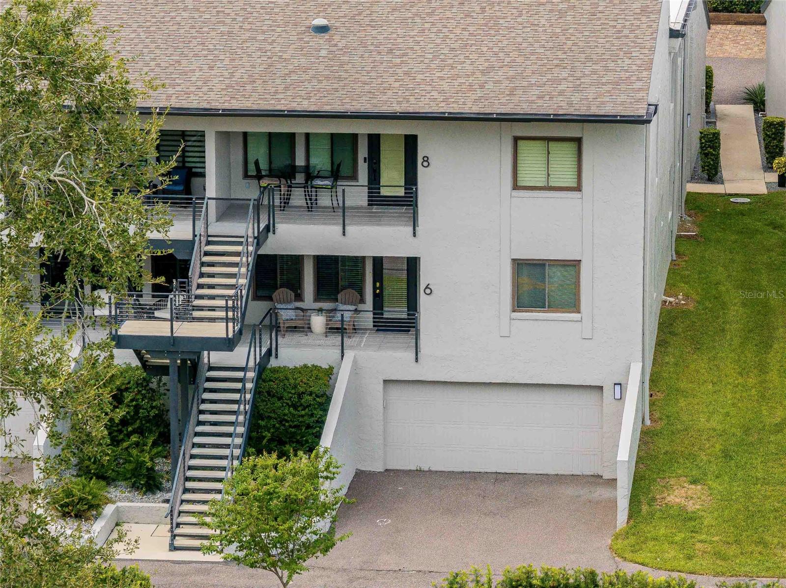 Welcome to 1 Lake Hollingsworth Drive #6, a rare opportunity to own a beautifully maintained 3-bedroom, 2-bath condominium in the highly sought-after Hollingsworth Place community. Nestled directly across from the picturesque shores of Lake Hollingsworth, this 1,492 sq ft home offers the perfect blend of comfort, convenience, and timeless charm. Begin your mornings on the inviting front porch, where you can sip coffee while taking in tranquil lake views. Inside, a spacious family room with a cozy fireplace creates a warm and welcoming atmosphere, ideal for relaxing or entertaining. The home features both a formal dining area and a bright breakfast nook, offering flexibility for hosting guests or enjoying quiet meals at home. A very oversized two car garage and inside laundry room are additional features! Enjoy maintenance free living just steps away from Lake Hollingsworth and a quick bike ride to downtown!
The primary suite serves as a peaceful retreat with its private bath and large walk-in closet, while a versatile third bedroom—currently used as a den—can easily be converted back into a guest room, home office, or media space. Additional highlights include an inside laundry room for added convenience and a two-car enclosed garage with ample room for storage or workspace. Located in a quiet, 12-unit community, this home offers maintenance-free living with HOA fees covering structural and exterior upkeep, allowing you to focus on enjoying the lifestyle.
Just steps away is the scenic 2.85-mile paved trail encircling Lake Hollingsworth—perfect for walking, biking, or jogging—while the vibrant culture of downtown Lakeland and the historic campus of Florida Southern College are only minutes away. With its unbeatable location, thoughtful layout, and serene lake views, this home is a true gem in one of Lakeland’s most desirable neighborhoods.