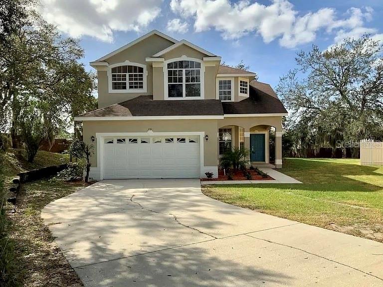 Stunning Two-Story Home for Rent in Ocoee, FL with a brand NEW ROOF installed on 6-10-2024! Welcome to your new sanctuary! This remarkable two-story home features 4 spacious bedrooms, 2.5 bathrooms, and ensures comfort and convenience for you and your family. As you enter, the elegance of vinyl flooring and high ceiling that flows throughout the living and dining areas will captivate your attention. The extremely large backyard, frontyard, and long driveway offer endless possibilities for outdoor activities, whether you’re hosting a summer barbecue or enjoying a quiet evening under the stars. The back yard features mango trees, passion fruit vines, pineapple, papaya, yucca, and much more which makes is a carribbean paradise right here in Ocoee. The home is so close the the Ocoee mall that you can see the AMC movie theater from the back yard. The 2-car garage, equipped with an automatic door opener, provides ample space for your vehicles and storage needs. Step outside to the huge patio, designed for entertaining friends and family or simply relaxing in the sunshine. The home is well maintained, with fresh paint and touch-ups that keep it looking brand new. Solar panels will your electricity bill extremely low. Inside, the large kitchen features beautiful granite countertops and modern light fixtures, making it a delightful space for cooking and gathering. Located in the charming city of Ocoee, you’re just a stone’s throw from the vibrant cities of Orlando, Winter garden, Apopka, and more. You’ll find major retail and grocery outlets like Publix, Walmart, and others just minutes away as well as and the West Oaks Mall in your backyard. And for those magical weekends, both Walt Disney World and LUniversal studio are conveniently located within a short drive. Don’t miss your chance to experience the perfect blend of luxury, convenience, and community in this stunning home! Schedule a viewing today and make this beautiful property your new home sweet home!