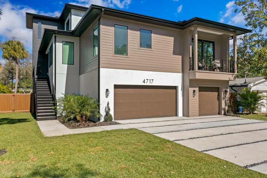 Exceptional South Tampa brand new modern construction in Sunset Park. Built by JPC Investments & Development, meticulously designed to deliver superior living in one of Tampa Bay’s best neighborhoods. The 3-story home built to the newest codes offers four bedrooms, four and a half bathrooms, and an impressive 4,670 square feet of living space. Upon entering the main level, you are welcomed by an open modern floor plan, spacious family room with accent wall and large format porcelain tile that flow seamlessly into the chef’s kitchen. The kitchen features a double island with a waterfall edge, modern black cabinetry and stainless appliances, with a professional range, and wine bar with refrigeration. The Primary Bedroom is located on the main level with wide plank oak flooring, private terrace, large his and hers custom closets, gracious bath with soaking tub, impressive 10 ft frameless glass shower, slate floor and floor-to-ceiling tile. A generous dining room, plus an office and powder bath complete the main-floor living spaces. The second floor features 3 additional ensuite bedrooms with large walk-in closets plus laundry. Outdoors, enjoy a covered terrace that leads to the private pool/waterfall spa, patio and side yard green space, with a privacy fence and landscaping. Additional features include a striking glass stairway and interior landing railing, impact resistant doors/windows, 3,000 sqft+ garage parking for approximately 10+ cars, with additional storage and bonus space. Offering superior South Tampa living and convenience to Tampa and St. Pete/Clearwater Airports, International and Westshore mall, shopping, dining, Hyde Park Village, award-winning beaches and top-rated schools.