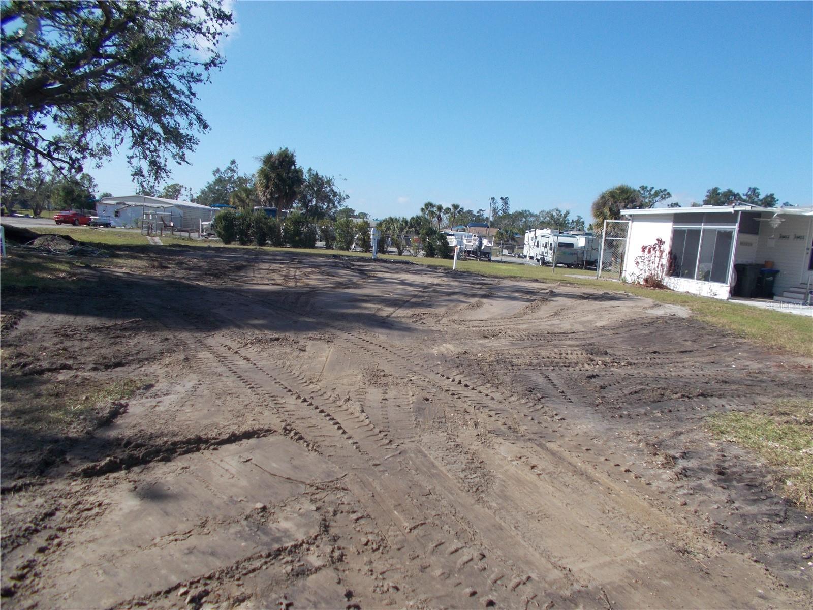 Vacant land in sought after Gated Community of Holiday Park, not in the pet section. In Holiday Park you own the land with a deed and the maintenance fee of $195.00 monthly ($2340.00 a year) is included in your taxes. This is a large corner lot measuring 7,665 sq ft. Holiday Park offers many amenities including 2 Pools, Tennis Courts, Pickle Ball, Bocci, Shuffleboard, Laundry, Library, Tennis, Horseshoes, Bingo plus other card games, Fitness Room and so much more. This is a perfect place for your new manufactured home. Come and see!