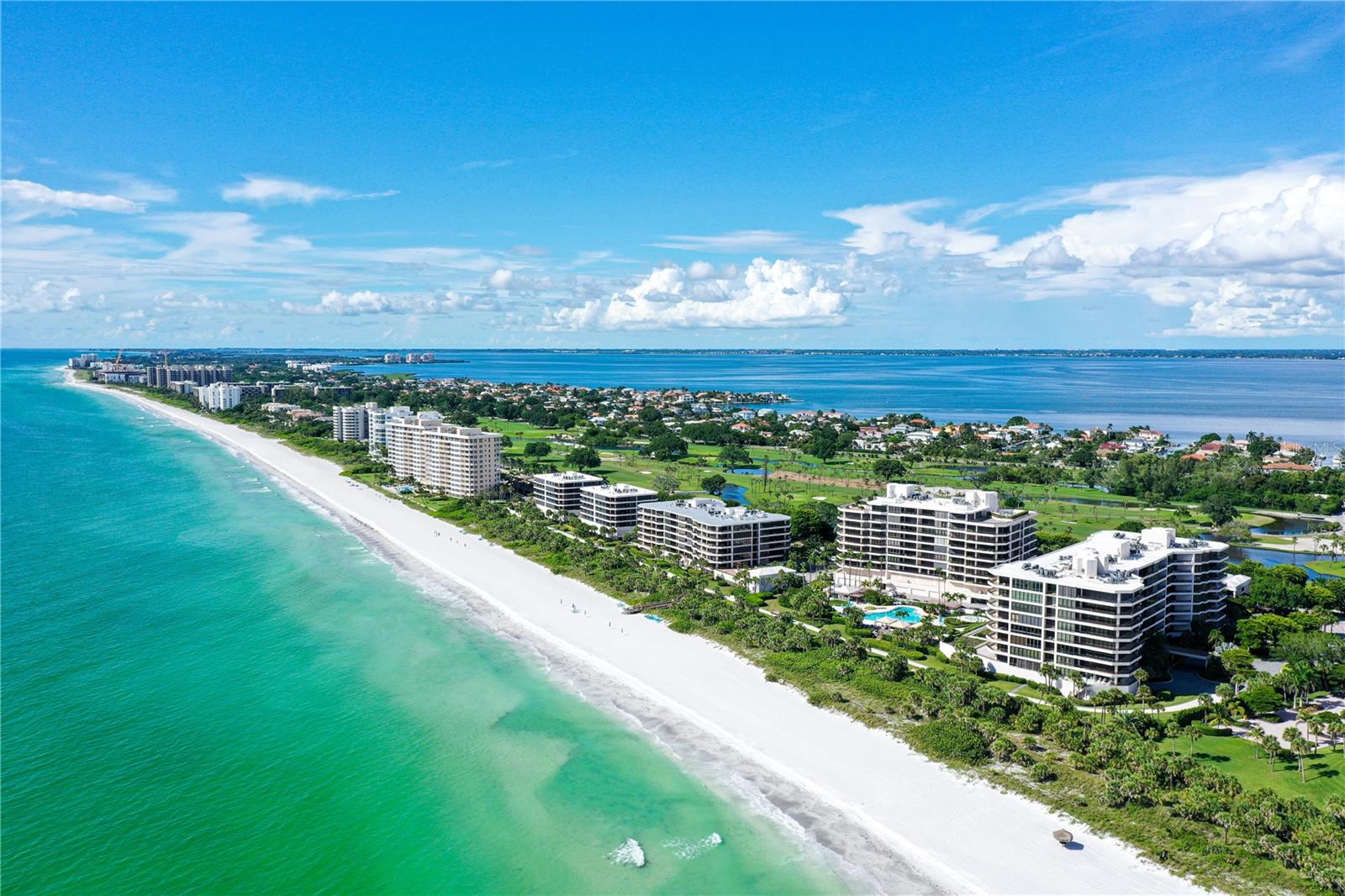 A Rare Jewel on Longboat Key – Luxury Beachfront Living at The Sanctuary
Welcome to an extraordinary opportunity to own a fully renovated, impeccably designed 3-bedroom, 2.5-bath residence in The Sanctuary—a premier Gulf-front community tucked behind the exclusive gates of the Longboat Key Club. This elevated retreat offers a front-row seat to both breathtaking sunsets over the Gulf of Mexico and picturesque sunrises over the golf course and Sarasota Bay, delivering sweeping, unobstructed views in every direction.
Step inside and experience the grandeur of coastal elegance. The spacious open-concept layout is anchored by a bright, airy living and dining area framed by floor-to-ceiling glass and sliding doors that lead to an expansive private balcony—your personal perch above the sea. Whether entertaining guests or enjoying a quiet morning coffee, this space seamlessly blends indoor comfort with outdoor splendor.
The split-bedroom design enhances privacy and flexibility. The lavish primary suite features a custom walk-in closet and a spa-inspired bath with an oversized glass walk-in shower, separate vanity space, and soothing finishes throughout. The guest suite, ideally positioned near the entrance, offers en-suite comfort, dual closets, and stunning views of the beach. A third bedroom—perfect as a den, office, or additional guest room—adds versatility to the floor plan. Additional highlights include a half bath for guests, a full-size laundry room with utility sink, and refined finishes throughout.
The Sanctuary lifestyle is truly unmatched. Residents enjoy access to resort-style amenities, including a Gulf-front pool with lap lanes and spa, a children’s wading pool, expansive sundecks with shaded gazebos, a well-equipped fitness center, Har-Tru tennis courts, saunas, a clubhouse, and 24-hour security. Stroll or bike along the community’s scenic path or take the private boardwalk to over 1,200 feet of pristine white sand beach—an open invitation to unwind by the sea.
Additional services include concierge-level security, on-site management, and secure, staffed gated access. The lifestyle here is effortlessly refined and deeply relaxing.
Situated just minutes from the vibrant shopping, dining, and cultural attractions of St. Armands Circle and downtown Sarasota, this residence offers the perfect balance of tranquility, luxury, and convenience.
This is more than a home—it’s a statement of refined coastal living. Don’t miss your chance to claim a rare slice of paradise on Longboat Key.
