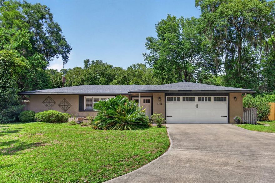 Welcome to Monterey and this 4 bedroom, 2 bath plus Florida room home with over 2,200 square feet in the heart of northwest Gainesville. Settled on the cul-de-sac of a quiet, neighborly street, this home is perfectly suited for anyone looking for a little piece of serenity and community. This fully renovated, 1974 ranch home boasts a spacious open-floor plan with laminate and tile flooring throughout (no carpet), crown molding, high-end finishes, large windows and French doors to enjoy the Florida sun. In the kitchen you’ll find chef-ready Kenmore Pro stainless kitchen appliances, including 6-burner gas range, side-by-side refrigerator/freezer, drawer-style microwave, farmer sink and separate large-capacity under-counter ice maker. There’s also a walk-in pantry with wine cooler.  Additional features include: plantation shutter blinds, granite countertops, soft-close drawers, ample lighting, and ceiling fans in all bedrooms and great room. The spacious owner’s suite has a large open bathroom with walk-in shower, double vanities, private toilet, two walk-in closets and French doors leading to a side patio with outdoor shower. The three remaining bedrooms all have large windows, spacious closets and are conveniently centered around the second bathroom. The kitchen is open to the Florida room and great room with gas fireplace. Outdoors, the property is fully landscaped including permanent garden features, mature trees and shrubs, updated fencing and natural gas patio grill with built-in granite counters. The yard is ideal for gardeners, birders, and those looking for space to run, play and entertain. Plus, there’s room to add a swimming pool. The patio is a birders paradise with visits to the backyard flora and feeders by cardinals, wrens, titmouse, chickadees, down/red-bellied/pileated woodpeckers, waxwings, blue jays, mockingbirds, catbirds, red-winged blackbirds, grackles, bluebirds and warblers, and painted buntings. Swallowtails, hawks, and ospreys are often seen soaring overhead with crows and butterflies cruising below the canopy. Worried about a power-outage? No problem, you’ll be able to watch the Weather Channel in the comfort of your air-conditioned, well-lit home with power supplied by a full-home 22KW Generac generator. Internet service is currently provided by IQ Fiberoptic. Monterey has no HOA and is conveniently located in the heart of Gainesville. Within 3 miles are restaurants, banks, credit unions, doctors, dentists, grocery stores, pet store, library and the Gainesville Community Playhouse.  It’s a short, easy commute to North Florida Regional, VA and UF Health hospitals, Santa Fe College, and the University of Florida! Call today to see this move-in-ready home for yourself!