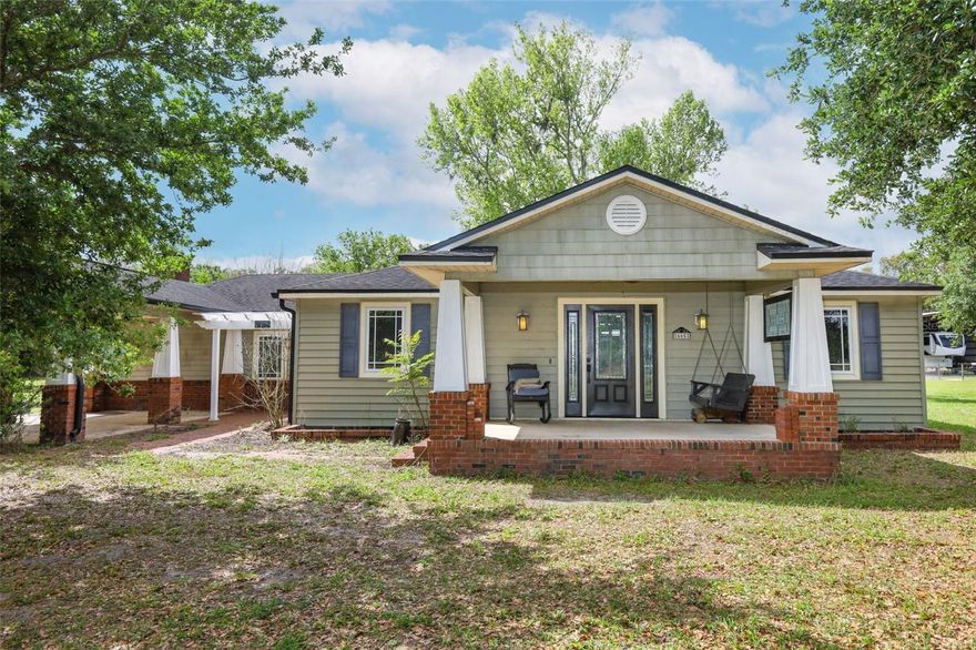 *Listed below appraised value*
This type of home with land does not come along every day! Do not miss this charming Craftsman-like home with a lovely porch to sit, swing and have your favorite beverage. There are two entrances to this home although the common entry area is off the double covered carport that has ceiling fans for those fun days you want to hang out with the family or need to work on a vehicle. Upon entering, you’ll notice the wide-open space with a wood-burning fireplace that can be used as a large family room, a game room, a personal library, and so much more! Off the left side of the Family Room is a Laundry Room with a work sink and plenty of cabinets and counters for storage and sorting, folding laundry. To the right is a lovely Florida Room perfect to use as a play area, great for the plant lover in your life, or set up as a wonderful reading nook with easy access to the back. There are 2 steps up from the Family Room on the right that takes you to the Primary Bedroom and the Kitchen area. The Primary Bedroom is large and has a lovely view of the back. The transition to the Primary en Suite has a wonderful built out walk in closet. The other bedrooms are wonderful and each has a step-in closet plus there is the second bathroom with hall access and a fun claw-foot tub and large linen closet. The Living Room has beautiful original archways with access to the bedroom hall on the right and eat-in kitchen access to the left and in the center of the Living Room is a beautiful craftsman-like wood-burning fireplace. The land surrounding the home is primarily cleared with easy access to the workshop in the back. This land is fully fenced and a great place to raise animals like chickens, to have a garden, to host memorable get-togethers, and to work on your own special hobby. This home is less than a mile to Lake Mills Park offering a mix of recreational activities like playgrounds, fishing, and camping, with scenic views of a hardwood swamp and the beautiful Lake Mills. This home is in the heart of Chuluota with some of the top Seminole County Schools. You get the best of both worlds with easy access to main road in a country living setting. Don’t wait to take a look at this rare unique property!