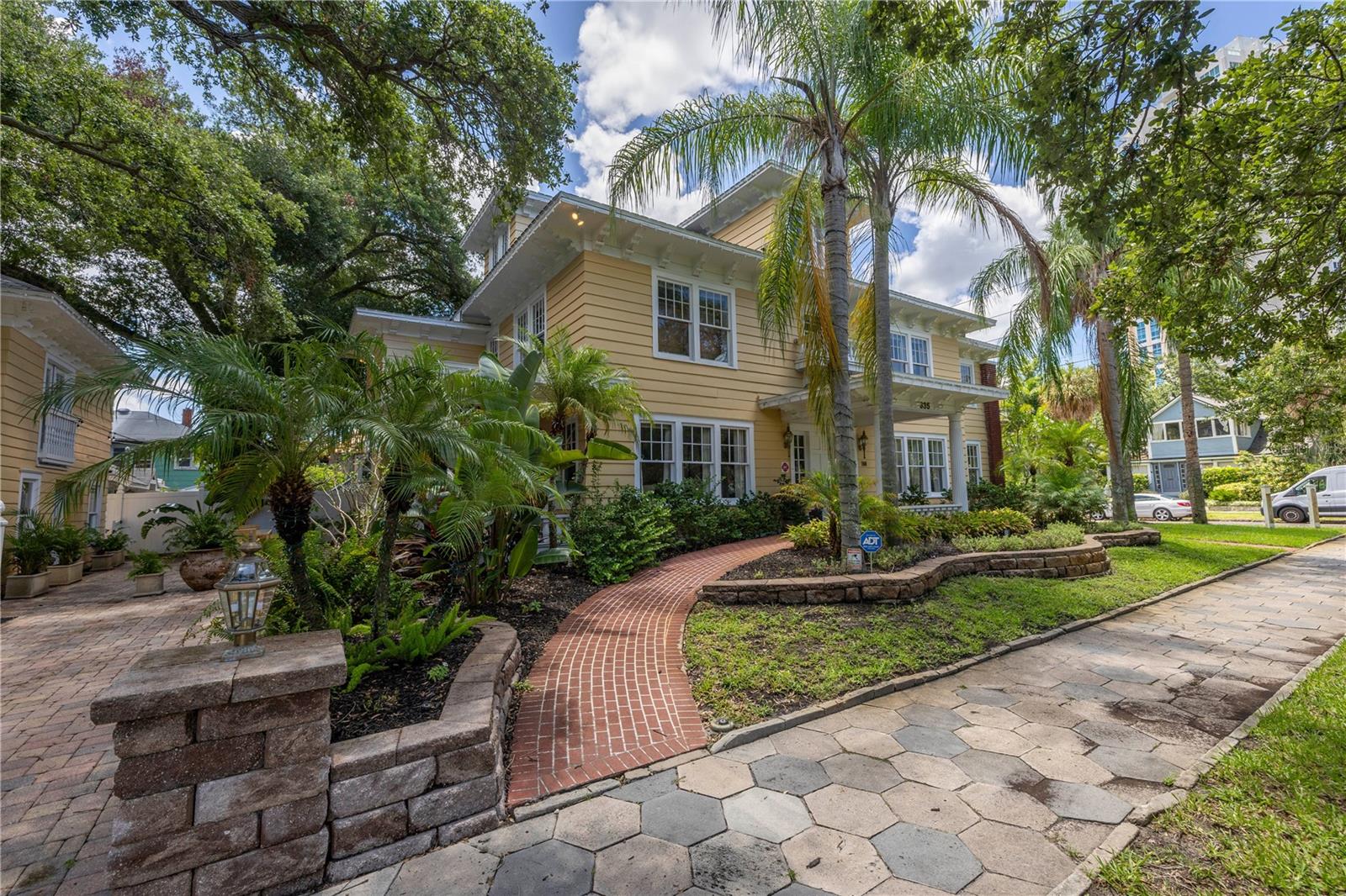 LIVE IN THE MAIN HOUSE, AND THE CARRIAGE HOUSE RENTALS HAVE THE POTENTIAL OF $150,000 IN ANNUAL INCOME!
WELCOME TO THE HISTORIC OLD NORTHEAST NEIGHBORHOOD OF ST PETERSBURG, FL, THE SUN IS AWAITING YOU! Residents and guests delight in the peaceful and picturesque brick streets, where trees form graceful, arching canopies over the homes and sidewalks. Nestled on a corner lot just one block north of Downtown St. Pete and one block west of The Vinoy, this elegant home, built circa 1914 and originally named the Boyce Guest House, was designated a Historic Landmark by the City of St. Petersburg in 1997. A brick U-shaped walkway guides you to the front covered portico and into the grand foyer, featuring an oval trayed ceiling and flanked by four fluted columns. Adjacent to the foyer, you'll find both the expansive formal living and dining rooms, ideal for gatherings with family, friends, and guests alike. The living room features a gas-plumbed fireplace and seamlessly connects to a sunroom facing south, perfect for enjoying the St. Pete sunshine. Meanwhile, the dining room comfortably accommodates a table large enough to seat 8 to 10 family members or guests. The chef’s kitchen has been updated with cabinets and appliances, highlighted by a five-burner gas cooktop. Adjacent to the kitchen is a generous laundry room equipped with oversized units, complemented by a full bath for the convenience of the first-floor bedroom (perfect for an Innkeeper’s room). Connecting the kitchen and dining room is the butler’s pantry, featuring two French doors that open onto the expansive northside porch. This peaceful outdoor space overlooks a serene patio shaded by two magnificent oak trees and surrounded by lush landscaping. The six bedrooms spread across the second and third floors each boast ensuite bathrooms, complete with jacuzzi tubs, except for one (on the third floor) which features an antique clawfoot bathtub. All rooms are flooded with natural light, and the second-floor primary bedroom includes a south facing sunroom. The carriage house offers 3 generous suites available for short-term or long-term rental, or as in-law accommodations. The second-floor suites feature vaulted ceilings and a porch, perfect for unwinding and savoring the tranquility of the neighborhood. This home boasts several standout features, including original oak hardwood floors, stained glass windows, multiple French doors, exposed brick in the sunrooms, multiple HVAC units, a generator for power outages, tankless water heaters powered by gas, updated plumbing and wiring, as well as a spacious patio and shaded parking area. The location of this property is truly exceptional. It is conveniently situated: just 2 miles from Interstate 275, 18 miles from Tampa International Airport, 13 miles from St. Pete-Clearwater International Airport, and 21 miles from Downtown Tampa. Within the local area, it's only a block away from Downtown St. Pete, and 9 miles to the nearest Gulf beaches. Nearby attractions include The Vinoy, multiple bay front parks, The Museum of Fine Arts, the newly revamped St. Pete Pier (including Spa Beach, shopping & restaurants), the Central Yacht Basin, and Beach Drive, renowned for its outstanding restaurants, shops, and lively nightlife. This property is perfect for a family looking to take pleasure in its many amenities. Additionally, with its current license and operation as a Bed & Breakfast, it presents a great opportunity for an inn operator or investor.