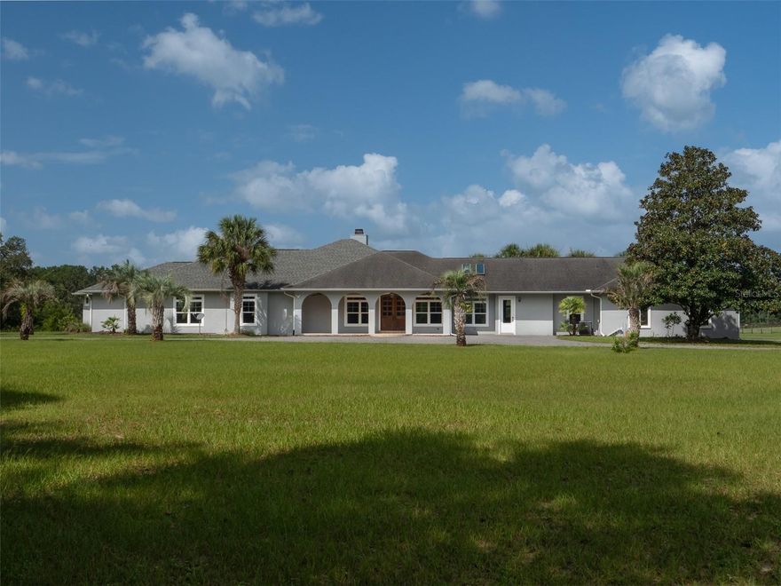 This beautiful 42.83 acres is conveniently located just minutes from Ocala, and in less than than 30 minutes you'll find yourself at the entrance to the renowned World Equestrian Center! Imagine having the peace and serenity of country living, and yet having this first class facility, with its eateries, shops, horse events, and year-round festivities at your fingertips! This farm is lush with green grass, board fenced, and supplied with run-in shelters, and plenty of shade trees. The main home underwent almost a total renovation in 2021, including the addition of 1800 square feet, including new master bedroom and bath, new roof and hvac, new windows, and kitchen. This spacious home is loaded with windows for an abundance of natural light, and features a gorgeous double door entry, stunning brick fireplace, and large island kitchen with stone counters, and beautiful wood cabinetry. The huge en suite master is nothing short of a 5-star resort, with his and her vanities and closets, a fabulous chandelier, and tons of storage. This farm features a 4-stall main barn with extra-large tack room, feed room, and 2020 roof and roof construction for better airflow. There is an additional 5-stall barn that includes hay and equipment storage. In addition, this farm has a 1800 square foot 3 BR/2 BA guest house that is just as lovely as the main home, and includes its own 2-car garage. This farm is ready for you to move right it. The Florida equestrian lifestyle is waiting for you.