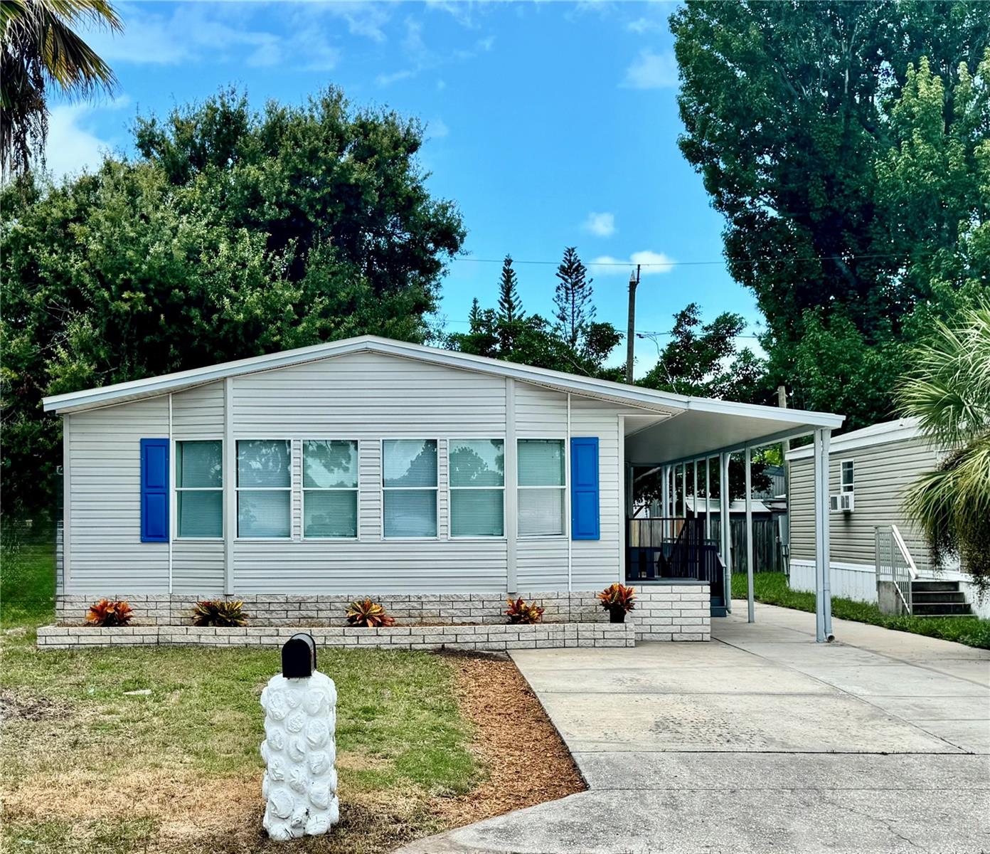 Welcome to this beautifully updated 2 bedroom, 2-bath double-wide manufactured home, perfectly situated on its own private lot in desirable St. Petersburg, just minutes from shopping, dining and Florida's famous Gulf beaches. The open kitchen features a convenient island cooking area and flows seamlessly into the dining room which overlook the spacious screened porch - perfect for relaxing or entertaining. Additional highlights include an inside laundry room, a walk-in closet for ample storage and a large bay window in the master bedroom that fills the space with natural light. This move-in ready home comes with all furnishings offering comfort, style and a fantastic location.