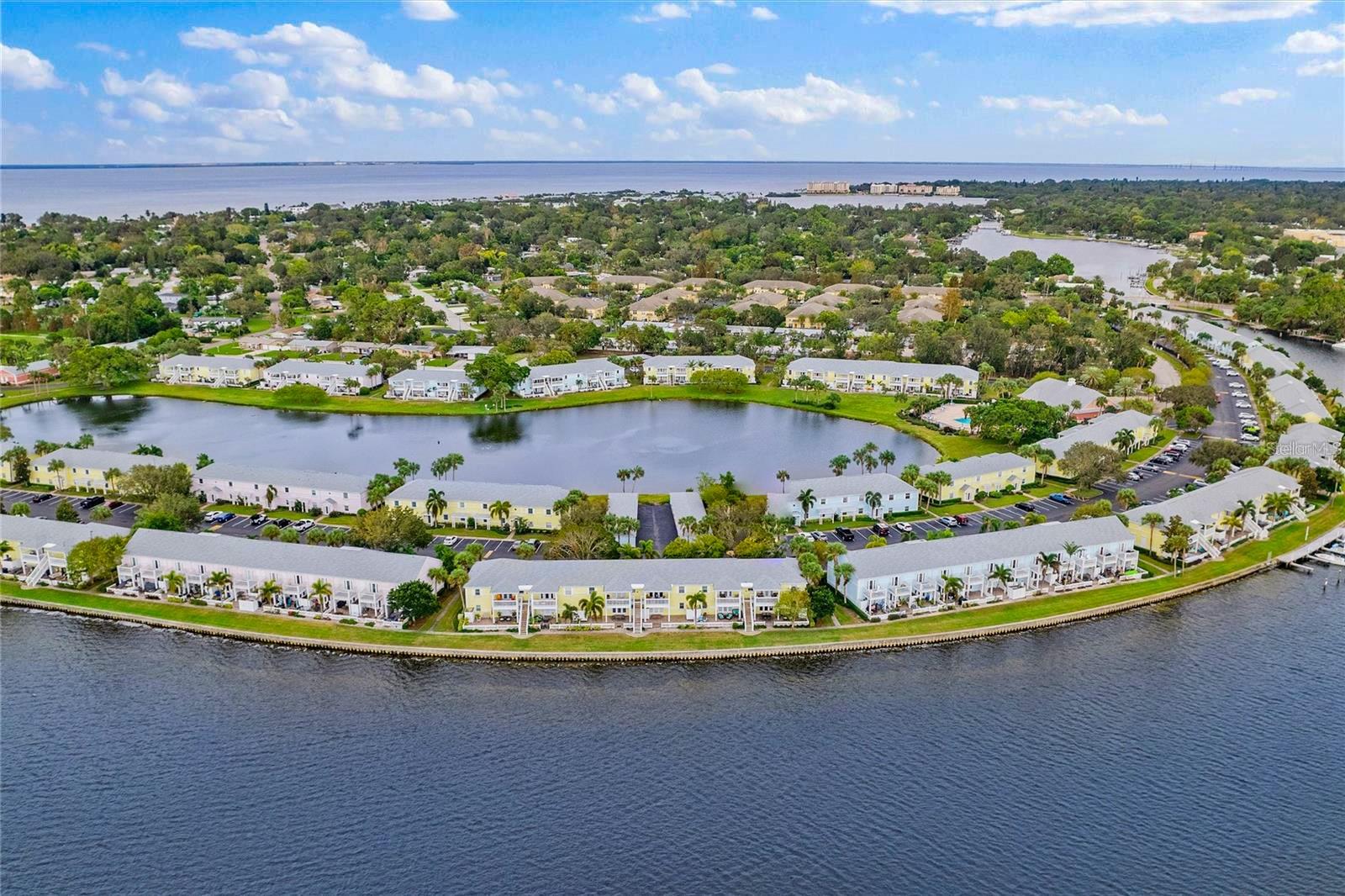 Welcome to Paradise! Waterside Condos North Village is the best kept secret in FL. This Condo is Two bedroom and Two bathroom with mahogany Wood kitchen Cabinets, brand new stainless-steel appliances, stackable full-size washer & dryer, high ceilings, new fixtures. and hurricane windows. Luxury Vinyl plank waterproof floors throughout. Located on 2nd floor with a covered balcony overlooking the Lake and pool view. Rent Includes: Cable TV, Internet, Pest Control, Repairs, Water & Sewer, Trash. From the moment you enter Waterside at Coquina Key it is a friendly small-town neighborhood with picturesque views of the Sunshine Skyway Bridge, Bird Island and Tampa Bay. 24 hr. staffed gatehouse. Full service of amenities Laundry Facilities, 3 over-sized swimming pools (heated) and 3 Jacuzzi spas, Yacht Club has restaurant/bar, banquet space, library, and billiards room. 2 State-of-the-art fitness centers with saunas and cardio room, tennis & basketball, volleyball, Pickleball courts, pet park, fishing piers, 3 miles of seawall & walking paths, kayak storage, boat parking, bicycle racks, electric car charging station. Just minutes to Downtown St Pete, shopping, restaurants, the Gulf beaches, Marinas, Eckerd College, Stetson School of Law, Ft DeSoto Park, Dali Museum, Tropicana Field and I-275 to Tampa or Bradenton/Sarasota