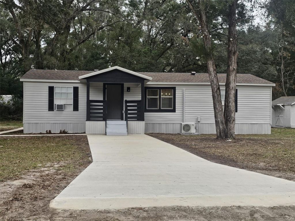 Photo of 6519 NE 23rd Avenue, Ocala, FL 34479 (MLS # G5111880)