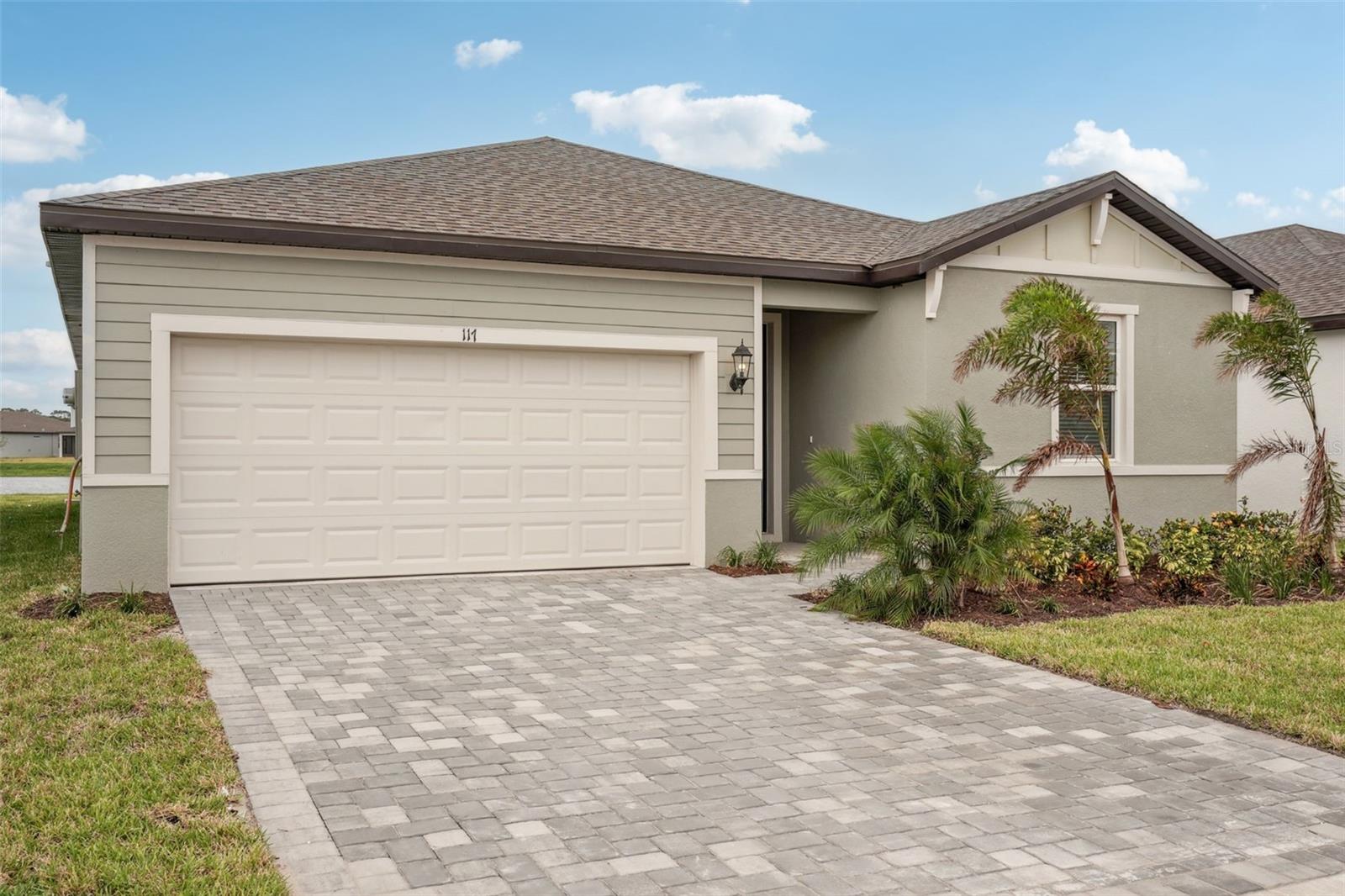 Brand new, energy-efficient home available NOW! This brand new pond-view home features many upgraded features. Enjoy the piece of mind of having impact-resistant glass windows and front door. Inside, this home features a stylish Elegant Minimalism design collection of professionally-coordinated upscale finishes. 6x36 wood look floor tiles flow throughout all the main areas of the home. The kitchen features gourmet appliances including a double wall oven. The kitchen quartz countertops are premium and the backsplash is an elegant marble. Whi shaker-style cabinetry with contrasting blck hardware throughout make a stylish statement. The charming exterior features upgraded landscaping and a paver driveway for added curb appeal. Convenient to I-75, this community offers easy access to plentiful shops and restaurants in downtown Sarasota and Venice. Residents will enjoy fabulous amenities that include a clubhouse, resort-style pools, fitness center, sports courts and more. Explore Magnolia Bay and see the benefits of a new home today. Each of our homes is built with innovative, energy-efficient features designed to help you enjoy more savings, better health, real comfort and peace of mind.