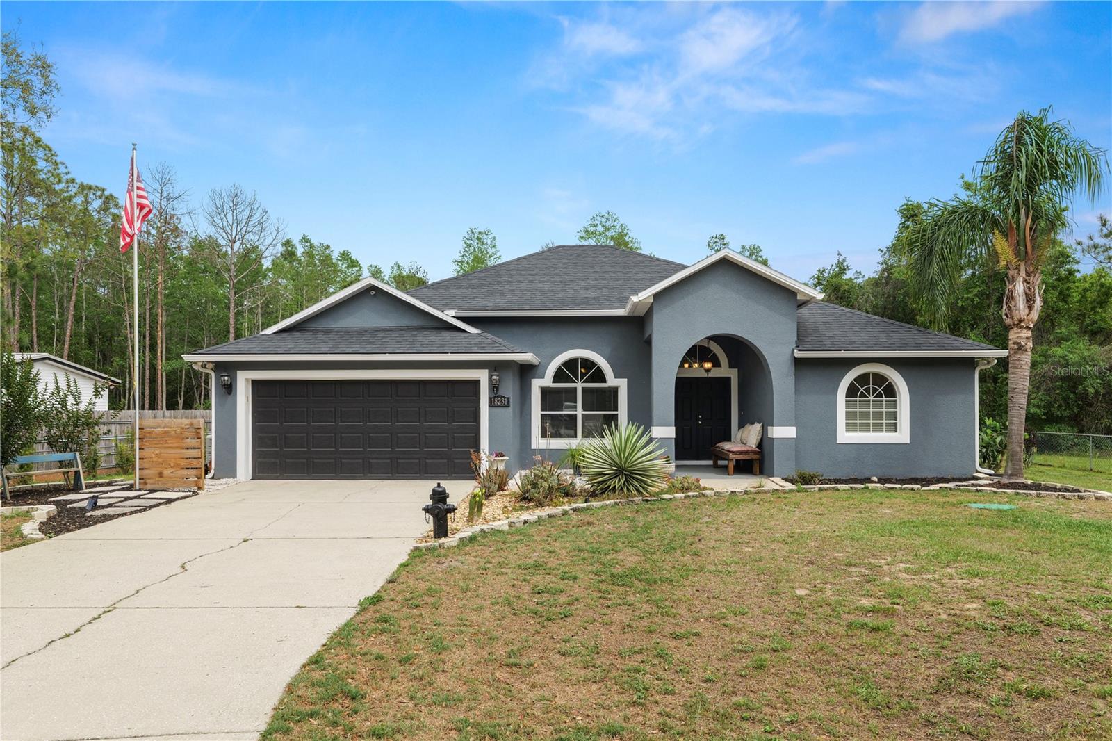 Welcome to your private retreat sitting on almost 5 acres with NO HOA! This 4 bedroom 3 bathroom home has so much to offer! Recent updates include a NEW AC & Water Heater in 2025, NEW 100 gallon water tank for water treatment system in 2024, NEW roof in 2023, LVP flooring installed in 2022 and a NEW propane pool heater in 2019. Additionally, the home is equipped with a Generac Propane Whole House Generator with Auto Switch and leased 100 gallon propane tank. Arriving at the home, you’ll appreciate the front entry gate, for additional security, as well as the beautifully landscaped front yard. Stepping inside you’ll find the living room/dining room combo with new LVP flooring and plenty of natural light. The perfect spot for dinner with family and friends. Entering the kitchen from the dining room, you’ll find ample cabinet space, as well as granite countertops, updated backsplash, stainless steel appliances as well as a breakfast bar, a great spot for a quick meal! The open family room offers plenty of space with sliding doors out to your outdoor oasis! The primary bedroom is generously sized with sliding doors to your pool, and an en-suite featuring a large soaking tub, stand up tiled shower, dual vanities, and spacious closets. The remaining 3 bedrooms have plenty of space and share the remaining 2 bathrooms, one featuring a single sink vanity with tub/shower combo. The pool bathroom features a stand up shower and single sink vanity. Stepping outside you’ll find the perfect Florida retreat! A screened in covered patio and heated pool! Additionally, outside of the pool area you’ll find a wood pergola with solar lighting along with a deck for entertaining. The front half acre of the property is fully fenced in. Zoning allows for farm animals and chickens. This home has it all! Schedule your private showing today!