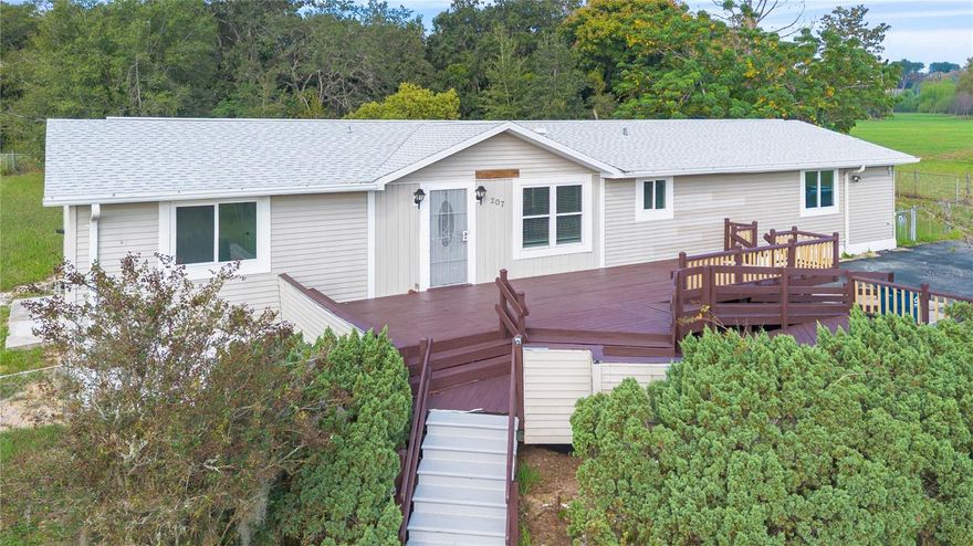 Welcome to your fully renovated Florida retreat, a charming home sitting on almost one acre (0.93 acres) of completely fenced land with no HOA, giving you the freedom to truly enjoy your space. Bring your RV, boat, or build your dream outdoor area. The possibilities are endless!

This home has been completely renovated inside and out, featuring a new roof (2023), new water heater (2023), upgraded windows (2017), new kitchen with modern cabinets, countertops, and stainless-steel appliances, and four large, comfortable bedrooms. The home is built on a solid block foundation and includes two efficient A/C units to keep you cool all year long.

Enjoy an open-concept layout perfect for entertaining, plus a handicap-accessible ramp for easy access. Outside, the lush green lawn, mature trees, and spacious deck make it ideal for relaxing or hosting friends and family.

Located in the heart of Davenport, this property has the perfect balance, a quiet residential area, yet just minutes from Highway 27, I-4, shopping, restaurants, and world-famous attractions like Disney. You’ll love the peaceful surroundings while staying connected to everything Central Florida has to provide to you.

If you’ve been looking for a move-in ready home with freedom, privacy, and plenty of land, this is the one!