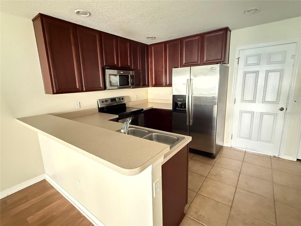 Photo of 287 Winding Vine Lane #34, Orlando, FL 32824 (MLS # O6441384)