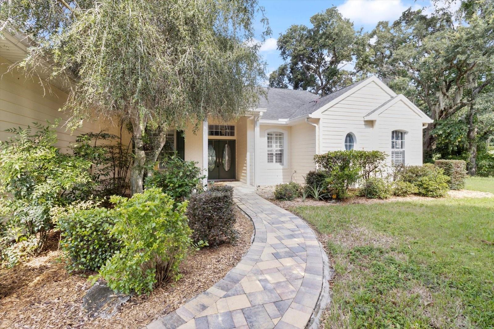 Welcome to your dream home in Southern Woods at Sugarmill Woods! This stunning 3-bedroom, 2-and a half bathroom residence boasts an impressive 3-car garage and is situated on a picturesque golf course lot, offering breathtaking views of the lush greens and tranquil surroundings in Homosassa, FL. From the moment you arrive, you’ll be captivated by the inviting front porch and the elegance of the home’s design. Step inside to discover a light and bright living space featuring a cozy family room with a gas fireplace, perfect for relaxing with loved ones. The gourmet kitchen is a chef’s delight, showcasing granite countertops, stainless steel appliances, a center island with a wine refrigerator, a breakfast bar, and a closet pantry. The adjoining eat-in space offers a charming spot for casual dining. Entertain guests or unwind in style on the screened-in lanai, which overlooks the stunning golf course views, and take a dip in the sparkling pool or enjoy the spa for ultimate relaxation. There is also an outdoor shower. The formal living and dining rooms add a touch of sophistication for more elegant gatherings. The spacious primary suite is a true retreat, complete with an ensuite bath featuring granite counters, a double vanity, a luxurious soaking tub, and a walk-in shower. A versatile den/office space, a large laundry room with ample storage cabinets, and a desirable cul-de-sac location round out this exceptional property. Don’t miss your chance to own this remarkable home in a coveted community with fewer than 300 homes, all within easy reach of golf course amenities. Schedule your showing today and make this your new oasis!