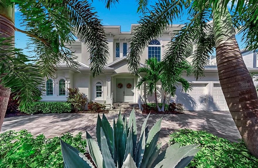 Welcome to your own luxury waterfront retreat in the coveted gated community of MiraBay, where sophistication, comfort, and resort-style living come together in perfect harmony.  From the moment you step through the front door, you’re greeted by soaring ceilings, natural light, and sweeping water views that immediately draw you toward the heart of this exquisite home. Thoughtfully designed with refined finishes and timeless style, each space flows effortlessly, creating a perfect balance between modern luxury and relaxed coastal living.  The main living areas open seamlessly to your outdoor oasis, where every detail has been curated for entertaining and tranquility. A custom outdoor kitchen and bar with built-in grills sets the stage for unforgettable gatherings. As evening falls, the ambiance comes alive with custom landscape and pool cage lighting, reflecting across the sparkling pool and spa, all easily managed with the OmniLogic wireless controller. A remote-controlled SunSetter shade extends comfort and sophistication, allowing you to enjoy the Florida lifestyle year-round.  Your private dock with a 13,000-pound boat lift invites endless adventures on the water, while the circular driveway and lush landscaping create a grand first impression.  Inside, every bedroom is a private retreat, each featuring its own ensuite bathroom. Upstairs bedrooms open to private balconies, offering serene morning views and gentle coastal breezes. A bonus room provides flexible living space, perfect for a media room, gym, or home office. The primary suite is a sanctuary of its own, showcasing a custom walk-in closet by California Closets and luxurious finishes designed for ultimate comfort.  This home also features hurricane-impact windows on all windows, whole-home gutters, and a water softener system for peace of mind and everyday convenience.  As a MiraBay resident, you’ll enjoy world-class amenities including tennis, pickleball, and basketball courts, a fitness center, a resort-style pool, three playgrounds, and a charming waterside café, all within a short stroll or golf cart ride from your door.  Combining luxury design, modern comfort, and resort-style living, this exceptional waterfront home captures the very essence of the Florida coastal lifestyle—from the moment you enter to the moment you step into your own private paradise outdoors.  Don’t miss out on your opportunity to tour this amazing waterfront home!