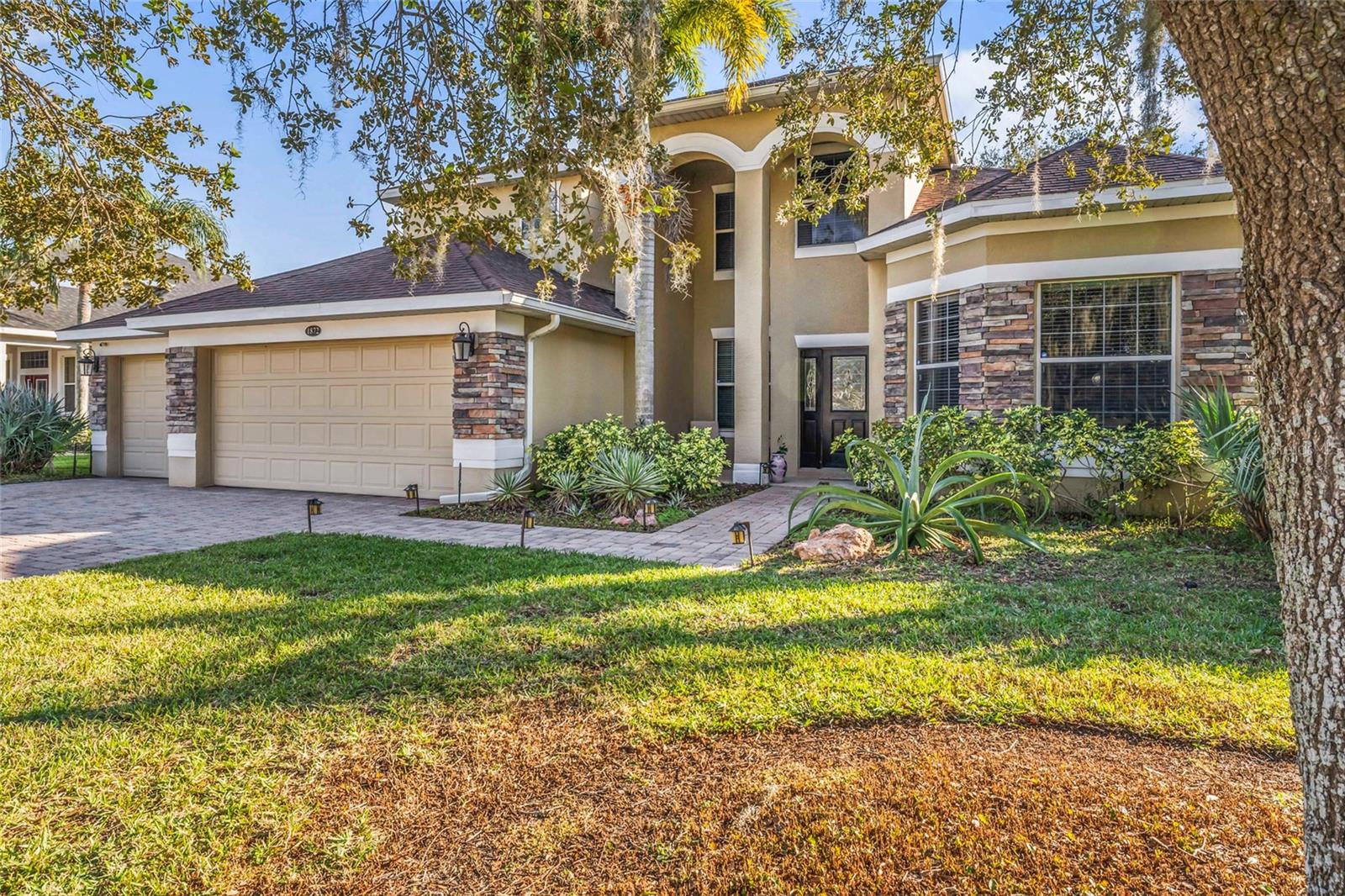 Prepare to be impressed with this stunning home in the amazing Eloise Cove Community! Discover your dream home in the highly sought-after, gated lakefront community. This spacious 4-bedroom, 3.5-bathroom, 3-car garage offers 3,716 square feet of beautifully designed living space, perfect for both relaxation and entertaining. As you arrive, the mature, well-manicured landscaping and expansive brick paver driveway set the tone for this elegant home. Step inside to be greeted by soaring ceilings, the dining space, beautiful trim work, and an open-concept floor plan. You will LOVE the luxurious downstairs primary bedroom with a tray ceiling and room for a sitting area, and an oversized walk-in closet. The primary bathroom is a spa-like retreat with dual vanities, a walk-in shower, and a soaking tub. Perfect for the chef in the family, the kitchen offers 42-inch glazed maple cabinets, granite countertops, a spacious island, stainless steel appliances (including a double oven), and a breakfast nook. Also located downstairs is an office at the entrance that doubles as an optional fifth bedroom. The great room flows seamlessly to a screened back porch, which opens to the incredible fenced backyard with pavered patio shaded by lovely oak trees, providing the ultimate space to unwind. Upstairs you will find a generous bonus room perfect for a media space or playroom, three large bedrooms, a full bath, and a Jack-and-Jill bathroom. Eloise Cove is a tranquil community offering residents access to a private dock on Lake Eloise, part of the Winter Haven Chain of Lakes. The location provides the perfect blend of serene lakeside living and modern convenience, with shopping, schools, medical facilities, and Legoland just minutes away. This home offers the ultimate Florida lifestyle. Don’t miss the opportunity to own this exceptional home in this impressive community. The seller is offering the fitness equipment inside the home and the outdoor items for sale under separate agreement. A complete list can be provided to anyone who is interested in these items. Ages of roof (7 years), HVAC (4 years), and Hot Water Heater (1 year).