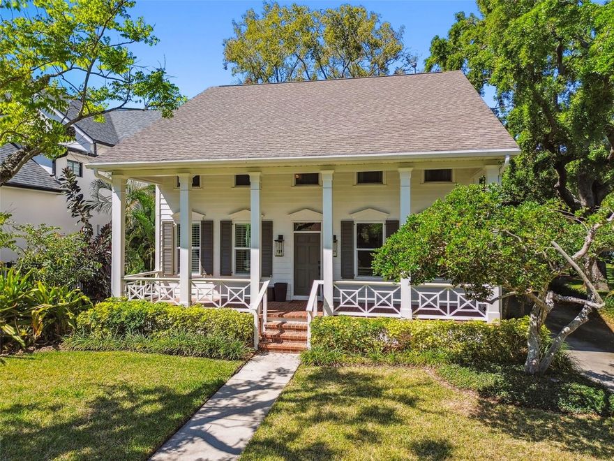This stunning South Tampa home, located in the desirable Parkland Estates neighborhood on a 60 x160 lot, is the epitome of timeless elegance and modern luxury. With over 4,000 square feet of living space, including the main house (3476 sq ft) and a guest house built in 2020, this property offers a blend of sophistication and convenience. The main house features 4 bedrooms and 4 baths with custom-stained hardwood floors throughout, complemented by white trim and doors. The $100K renovated European-style kitchen boasts Irpinia cabinets with a timeless wood-grain finish, brushed pearl granite countertops, a gas cooktop, and a full wine refrigerator. French doors in the kitchen lead to the lushly landscaped backyard, which serves as a tranquil oasis for morning coffee or evening gatherings illuminated by outdoor lighting. The kitchen flows seamlessly into the family room, which is anchored by a stunning gas fireplace and custom-built cabinetry matching the kitchen’s finish. The formal dining and living rooms provide elegant spaces for entertaining, while the plantation shutters on the main floor windows allow natural light to fill the home. The main house includes four spacious bedrooms and four full bathrooms. One of the bedrooms is on the main floor and is perfect for a home office, den, library or guest bedroom. The primary suite on the second floor features two walk-in closets, a jet tub, dual vanities, and abundant natural light, creating a true retreat. The other 2 generously sized bedrooms on the second floor include ensuite bathrooms adding privacy for everyone.  A second-floor laundry room offers additional storage and convenience. The second and third bedrooms each boast ensuite bathrooms, with the second featuring a tiled walk-in shower with a custom corner bench and the third showcasing an oversized extended vanity. The guest house, designed by Henry Mosely, offers an additional 528 square feet of living space. It includes a bedroom, large closet, bathroom, kitchen with stainless steel appliances, and a family room. Attached to the oversized two-stall garage with newly added a/c split, the guest house combines privacy and convenience. Notable updates to the property include a tankless water heater, closed-cell insulation, impact-resistant oversized kitchen windows and French doors. Modern appliances, including a dishwasher, microwave, and washer/dryer, were installed in 2019. This turnkey home is zoned for "A" rated schools—Mitchell, Wilson, and Plant High School—and is ideally located within minutes of downtown Tampa, Hyde Park Village, Bayshore Boulevard, Tampa General Hospital, and Tampa International Airport. Situated on a quiet street with minimal traffic, this exceptional property provides the perfect blend of charm, modern updates, and convenience. Schedule your showing today and make this extraordinary Parkland Estates property your new home.
