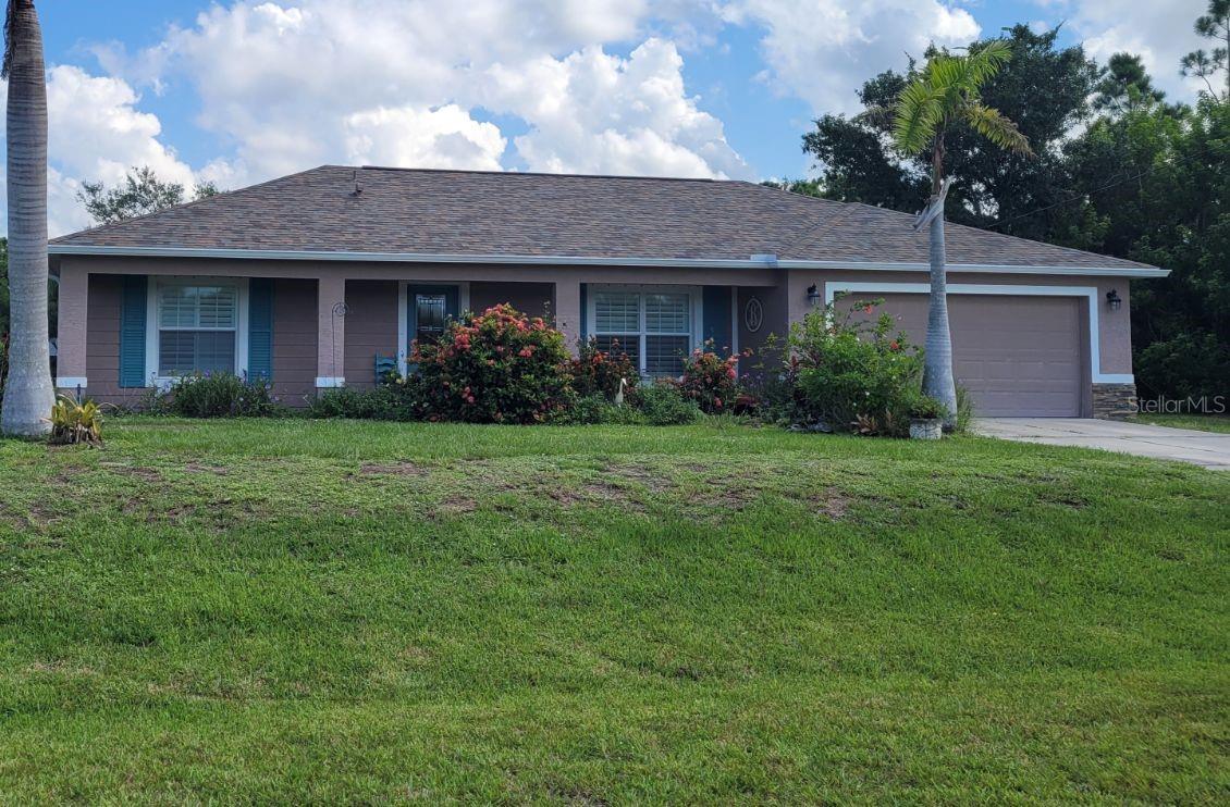 Lovely and spacious two bedroom canal home on the Newgate waterway and Ready for occupancy! This home checks all the boxes under a $300k price point with a new roof installed in 2023. Sellers added lots of upgrades to this home including humidistat, insulated lanai, extended concrete pad along the rear of the home, plywood flooring and lighting in attic for extra storage. Double glass french doors adds lots of light and leads you out to the enclosed Florida seasonal room. Both bedrooms have large walk-in closets and porcelain tile throughout entire home. Everything you need is in this home and more! Picture yourself in the Florida room, wired for television, either drinking your morning coffee or watching your favorite sports game. Private back yard where you will see birds, fish jumping, maybe an occasional canoe, as it backs to the Myakka State Forest.  If you love to fish, you never have to go farther than your back yard and home comes with fishing poles too! If you love to tinker, or are handy, check out the garage with a utility sink, bonus area for tools and lawn equipment. If you love to cook, you will appreciate the overstock of kitchen supplies for cooking, baking, or simple meals in the air fryer. Looking for a new place to call home? All appliance stay including washer and dryer in the oversized indoor laundry area. Beautiful custom plantation shutters in both bedrooms and living room, as well as the primary bath. Maybe you are thinking of adding to your portfolio or starting one with a rental property. Home comes turnkey and is ready for you to move in immediately and NO deed restrictions. Everything you see will be left for the convenience of the new homeowner including hurricane shutters. Live where you can play on the water with several beaches and boat ramps, along with kayak launches at some of the fabulous nature parks. Catch a Spring Training game at your choice of the Tampa Bay Rays or the Atlanta Braves stadiums. Be sure to check out Dearborn street for all the shoppes, restaurants, Farmer's Market, and Pioneer Plaza for local music. Easy access to I75 if you work, enjoy day trips, or access to airports.