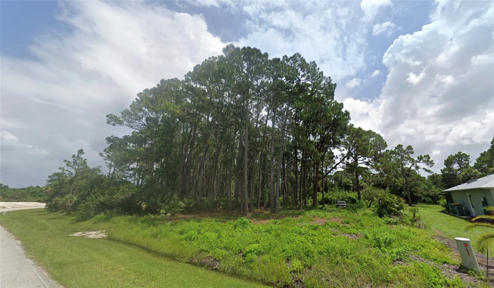 Prime 10,000 sq. ft. lot at 12203 Chamberlain Blvd, Port Charlotte, FL perfect for builders to create dream homes in a desirable, convenient location.