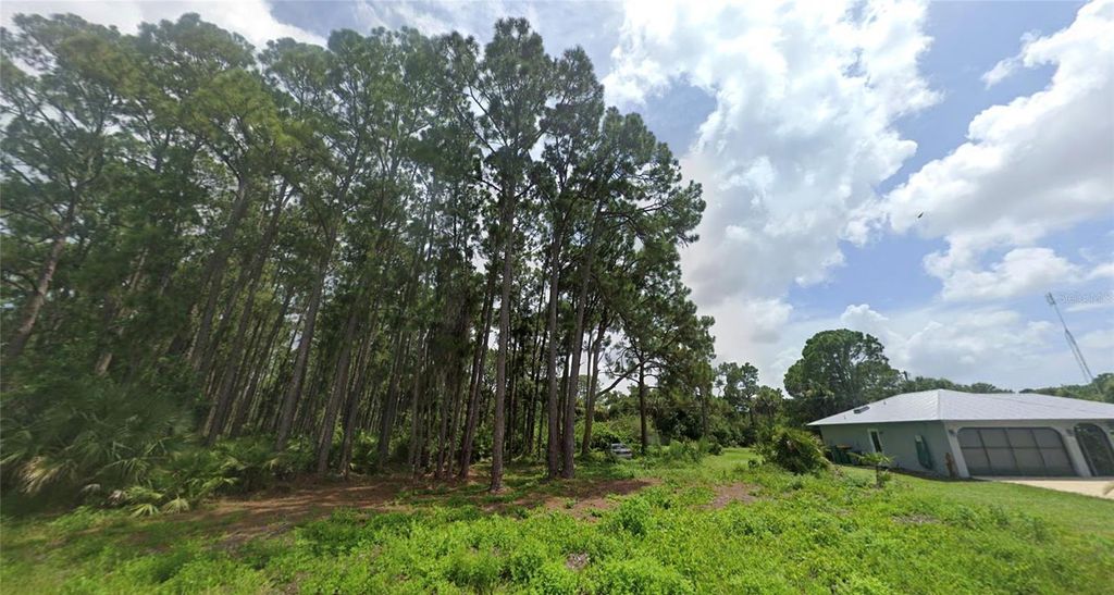Photo of 12203 Chamberlain Boulevard, Port Charlotte, FL 33953 (MLS # A4663274)