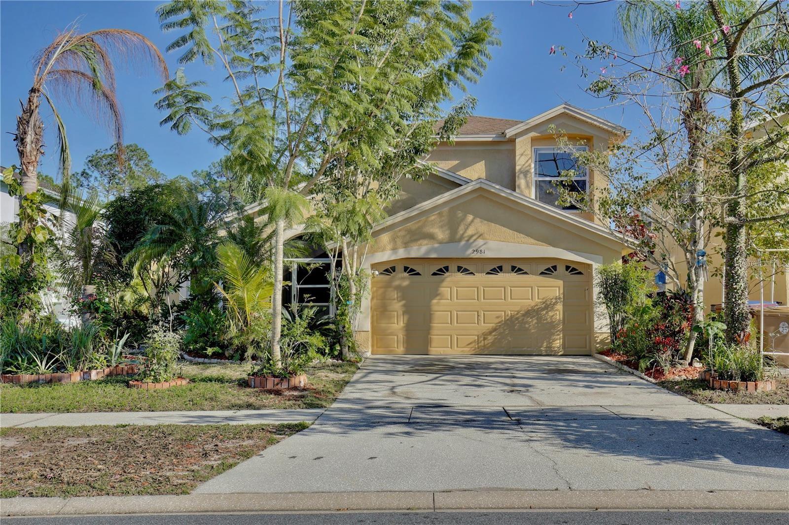 Experience the Florida lifestyle in this stunning waterfront home available for rent with flexible terms—3-month minimum followed by month-to-month options. Please note: the listed rental price reflects a 12-month lease. Just six miles from the enchantment of Disney World, this four-bedroom, two and a half-bath has breathtaking water views, a sparkling pool, and no carpet throughout. High-ceilings and tile floors enhance the expansive living areas, while neutral tones complement any décor. The kitchen is a chef’s delight, featuring all the appliances: refrigerator, ample pantry storage, wood cabinetry, backsplash, and charming custom swinging doors into a private dining area framed by sliding barn doors. The primary suite boasts pool and water views, a walk-in closet, dual sinks, a soaking tub, and a glass-enclosed shower. Upstairs, three sunlit guest bedrooms—one with a walk-in closet—share a full bath with generous counter space. Outside, enjoy your personal palm tree-framed waterfront views and the ultimate backdrop for relaxation or entertaining. Perfectly located near premier shopping, dining, golf and all the magic of Disney, this home lets you live every day like you're on vacation. Schedule your showing today and make this dream retreat your reality!