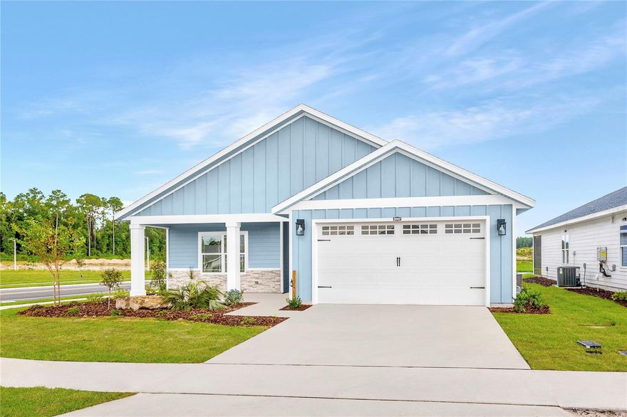 Pre-Construction. To be built. Set in Tanglewood in Newberry, FL, The Aspen by William Weseman Construction puts you in the middle of what makes this part of Alachua County so appealing: the small-town charm of Newberry and the conveniences of Jonesville and Gainesville. Built by a 3rd-generation local builder, this new construction home blends practical design, durable materials, and polished finishes. This 3-bedroom, 2.5-bath plan offers 1,653 heated and cooled sq ft with a thoughtfully designed layout that balances open living spaces with comfortable bedroom separation. The main living area features an open great room where the kitchen, dining, and living spaces flow together to create a bright central gathering area for everyday living and entertaining. The kitchen is anchored by a center island and includes quartz countertops, solid wood cabinets with soft-close drawers, tile backsplash, pull-out dual trash bins, and a stainless steel under-mount single-basin sink. A corner pantry provides additional storage, and included appliances are a stainless steel slide-in electric range, microwave, and dishwasher. The private primary suite is located at the rear of the home and features a spacious walk-in closet and a bathroom with dual sinks, a full tile shower, private water closet, and linen closet. Two additional bedrooms and a full bathroom with tub are located toward the front of the home, while a convenient half bath is positioned off the main living area for guests. The laundry room includes a utility sink. The covered rear porch spans the full width of the home, extending the living space outdoors. Additional interior highlights include LVP flooring throughout, ceramic tile in bathrooms, 9' ceilings throughout, recessed LED lighting, and ceiling fans. Exterior details include stacked stone accents, Hardie board siding with spacer clips and board-and-batten accents, 12"x12" columns, low-maintenance aluminum soffits, a fully sodded Zoysia yard, and a 2-car garage with an 8' door. Energy-smart features include Low-E windows, R-30 insulation, 15 SEER HVAC, electric water heater, and wi-fi enabled thermostat and garage door opener. Buying at this stage offers buyer design selections and personalization, with choices and upgrades available including, but not limited to, roof shingle color, exterior paint color, stone accent color, cabinet color, countertops, interior paint color, front door, and interior door style. Tanglewood’s planned amenities include a pool, playground, pickleball, covered pavilion, and sidewalks on both sides of the street. The $95/month HOA includes access to future amenities plus front yard mowing and maintenance. Community services include Clay Electric, the City of Newberry, and Cox Cable. Zoned for Newberry Elementary, Oak View Middle, and Newberry High School (buyers should verify school zoning). The location also offers convenient access to daily essentials and area destinations: 2.5 miles to Publix, 5 miles to area schools, 5 miles to Tioga Town Center, 6.5 miles to Jonesville Park, 4.9 miles to Easton Sports Complex, 8 miles to Diamond Sports Park, 9 miles to I-75, 13 miles to UF, 9.3 miles to HCA Florida North Florida Hospital, and 15 miles to the VA Hospital and UF Shands Hospital. Estimated completion: June 2026. Lot 3 is a 55' x 120' homesite. Photos are of a previously completed similar home; finishes and selections may vary. Reach out for availability, construction updates, and the current selections list.