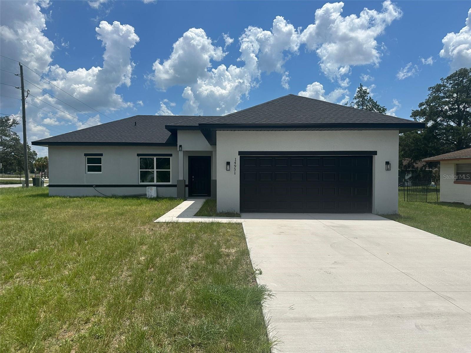 New Construction Corner Lot Home with Spacious Layout and Modern Features
Welcome to this stunning new construction home perfectly situated on a desirable corner lot in beautiful Ocala. Offering the ideal blend of comfort, style, and functionality, this property is ready to impress even the most discerning homebuyers.
Step inside to discover an expansive open floor plan that effortlessly connects the spacious living room, elegant dining area, and a beautifully appointed kitchen—perfect for entertaining and everyday living. The kitchen comes fully equipped with modern appliances including a range, refrigerator, microwave, and dishwasher, providing everything you need to start cooking from day one.
This home boasts three generously sized bedrooms, with the primary suite featuring a luxurious walk-in closet for all your wardrobe needs. The additional two bedrooms each offer built-in closets, providing ample storage and organization space for family or guests. You'll also enjoy two full bathrooms, designed with contemporary finishes and attention to detail.
For your convenience, the property includes a 2-car attached garage, offering plenty of room for vehicles, storage, or a workshop setup. With its corner lot location, you'll also enjoy added privacy and extra outdoor space—perfect for relaxing or entertaining outdoors.
Located near top-rated schools, this home is ideal for families looking for both modern living and a great neighborhood setting.
Don’t miss your opportunity to own this exceptional new home in one of Ocala’s most sought-after areas. Schedule your private tour today!