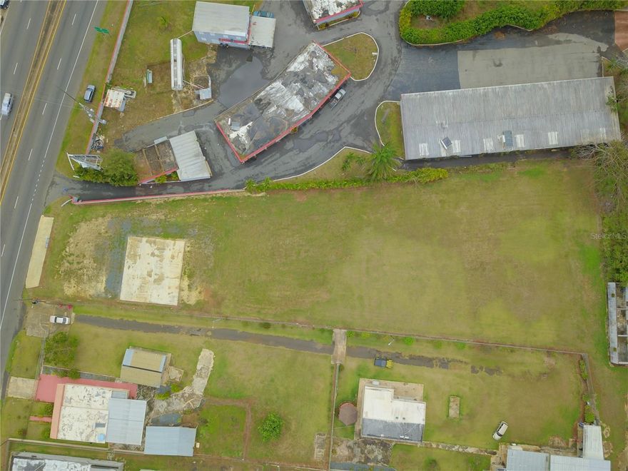 One or more photo(s) has been virtually staged.  Location! Location! Spectacular 1 acre piece of land completely flat with great traffic and ready for development. Located on the famous Road #2 steps from Plaza Isabela Mall and minutes from Jobos beach and Rafael Hernández airport. The potential and possibilities are endless on this land.
