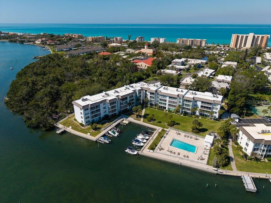 Enjoy the best of the Longboat Key lifestyle in this beautifully updated 2-bedroom, 2-bath waterfront condo at Sutton Place, offering a rare Gulf-to-Bay experience with Sarasota Bay views and PRIVATE DEEDED BEACH ACCESS to a Gulf-front beach just across the street. This light and bright residence features a spacious, open floor plan with quality finishes throughout, including porcelain tile and engineered hardwood flooring for a clean, modern, low-maintenance feel.

The updated kitchen is both stylish and functional, showcasing quartz countertops, a mother-of-pearl mosaic backsplash, tray ceiling, and stainless steel appliances. The primary suite includes a fully remodeled bathroom with quartz counters, custom glass shower, and marble tile, while the guest bathroom features granite countertops and a vessel sink. A glass-enclosed and screened lanai extends the living space, bringing in natural light and allowing you to enjoy peaceful bay breezes year-round. Recent upgrades include newly installed IMPACT RESISTANT WINDOWS & DOORS, providing added safety, energy efficiency, and peace of mind. Updated lighting was also added in the living area

This residence is being sold TURNKEY FURNISHED, making it truly move-in ready or ideal as a second home or investment property. As an added bonus, the sale includes four brand new KAYAKS—perfect for enjoying the community’s direct bay access and embracing the waterfront lifestyle.

Sutton Place is a highly desirable waterfront community offering exceptional amenities, including deeded Gulf beach access with pavilion, gated parking, showers, and picnic areas, TWO heated bayside POOLS, BBQ grills, BOAT SLIPS (first-come, $300/year), kayak storage and launch, fishing dock, clubhouse, and covered parking with ample guest spaces. The community is pet-friendly (2 pets up to 25 lbs each), not age restricted, and allows two rentals per year with a one-month minimum after the first year of ownership, making it ideal for both personal use and investment.

Recent community improvements include new roofs, exterior repainting, and resealing (2023), along with a completed milestone inspection. Ideally located mid-key, close to Bayfront Park, dining, shopping, and just a short drive to Anna Maria Island, St. Armands Circle, and downtown Sarasota. Don’t miss this opportunity to own a piece of paradise on Longboat Key.