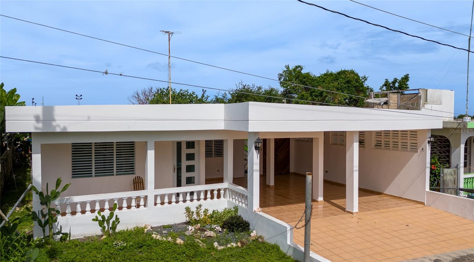 Discover this beautiful and well-maintained Esperanza home, featuring 3 bedrooms and 2 bathrooms, with approximately 1,000 sq. ft. of interior living space. Enjoy an additional 560 sq. ft. of space in the marquesina and front porch, plus another 250 sq. ft. of covered back porch area.
The home includes an eat-in kitchen with a separate entrance into the dining area, and a spacious living room at the front of the house. The bedrooms are conveniently located off the main hallway, along with a spacious primary bathroom.
Step out the back door to a serene retreat featuring a covered back porch, a second full bathroom, and a laundry area. This space offers potential for an additional unit, a large master suite, or an office.
The property includes a small banana patch and green space on the south side, creating an in-town oasis feel. You'll find ample closet and storage space throughout the home. The garage can accommodate 4 cars or be reconfigured for additional living space or another bedroom.
Recent updates include new windows and doors in the living areas, all new interior doors, lighting and beautiful coastal gray tile throughout. Both bathrooms have been fully remodeled including all fixtures, tiles and doors. The home features 3 air-conditioned bedrooms, all appliances included, making it move-in ready.
Located in the prime area of Esperanza, you'll be close to the world-famous Sunbay Beach, restaurants, shopping, and the natural wonder of the bioluminescent bay. Schedule your showing today as this Esperanza gem will not last long on the market.