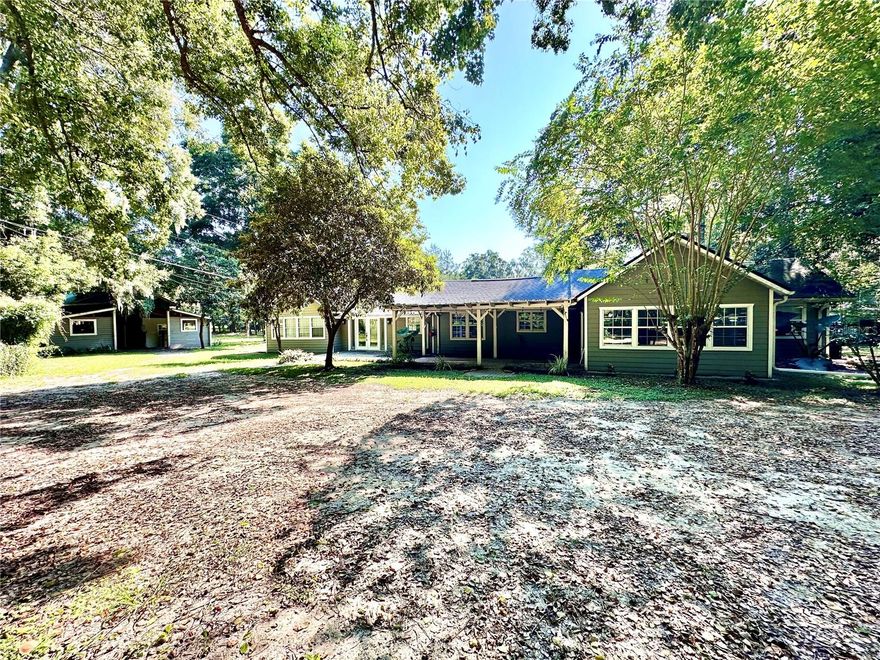 One or more photo(s) has been virtually staged. Renovated 1946 Horse Farm on 8.93 Acres Between Ocala & Gainesville

Tucked away at the end of a quiet dirt road, this beautifully renovated and gated 1946 farm offers a rare blend of historic charm, modern functionality, and private country living—ideal for the dedicated horse enthusiast seeking space, location, and versatility. Perfectly positioned between Gainesville and Ocala, the property also provides quick access to the Orange Lake boat ramp, just minutes away.

The farm is truly postcard-worthy, featuring classic horse fencing, rolling pastureland, and sweeping shade from mature Live Oak and camphor trees. Designed to support a variety of equestrian disciplines, the property is equally well suited for professional riders and serious amateurs alike. Eventers will appreciate the unbeatable location—just minutes from Majestic Oaks, the soon-to-open Ocala Jockey Club, and under 30 minutes to both the World Equestrian Center and HITS.

The residence offers flexible living options with two bedrooms plus a bonus room with a private entrance, easily functioning as a third bedroom, home office, or guest suite. The center-aisle barn includes 7 stalls with room for expansion, along with a tack/feed room, grooming area, and wash stall. For turnout, the farm features three large paddocks, each with water access and a combination of 3-rail board fencing and no-climb wire.

The property spans 8.93 acres across two parcels (7.73 acres + 1.20 acres). The additional 1.20-acre parcel adds exceptional value, as it previously hosted a mobile home and retains its own tax ID, separate access, power, well, and needs a new septic system, creating multiple future use or income possibilities.

If you’re searching for a horse farm for sale in Ocala, an equestrian property near World Equestrian Center, or a private farm with expansion potential, this property offers location, infrastructure, and lifestyle in one exceptional package.

Schedule your private showing today.