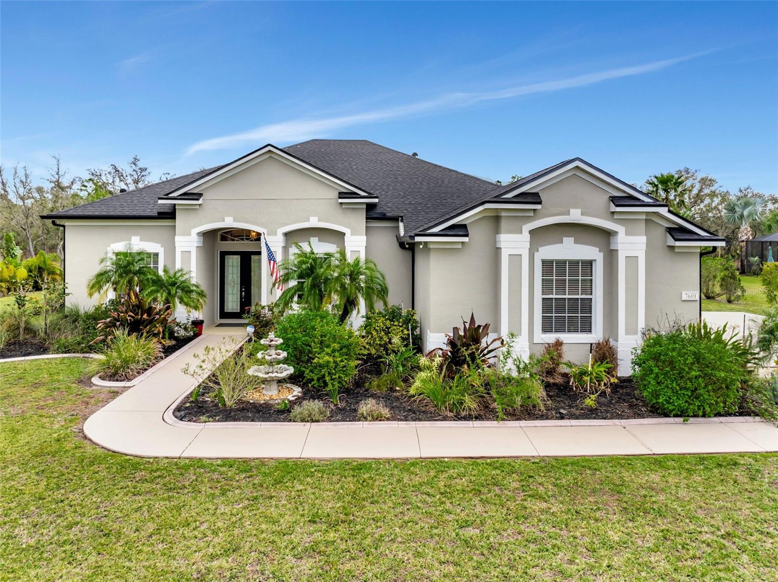 Situated on a private 1.3-acre lot, this stunning 4-bedroom, 3-bathroom Smart Home offers the perfect blend of sophistication, privacy, and modern technology. Located on a secluded dead-end street in the exclusive neighborhood, Grand Oaks at Panther Ridge, this estate-style residence is designed for luxury living.
Step through grand double glass doors into an elegant, light-filled retreat, where soaring tray ceilings, intricate custom crown molding, and handcrafted wood-trimmed archways exude sophistication and showcase impeccable craftsmanship. Newly installed, MOHAWK luxury vinyl wood plank flooring, adds warmth and refinement, seamlessly complementing the home’s timeless design. As you enter, your eyes are immediately drawn through the expansive sliding glass doors to the breathtaking view of the sparkling pool, creating a seamless connection between indoor luxury and outdoor serenity.
The heart of the home is a newly remodeled chef’s kitchen, designed to impress with 42” custom cabinetry featuring app-controlled under-cabinet lighting, a striking glass backsplash, and luxurious granite countertops. A spacious breakfast bar serves as the perfect spot for morning coffee or entertaining guests, while a separate, thoughtfully designed coffee station offers a dedicated space for brewing your favorite beverages. Complete with sleek stainless steel appliances—including a WiFi-enabled oven—this kitchen seamlessly blends modern technology with timeless elegance, making it a true culinary masterpiece.
Designed for effortless indoor-outdoor living, the expansive great room perfectly extends to a private backyard retreat. A resort-style pool and spa, enhanced with app-controlled lighting and tranquil fountains, set the stage for ultimate relaxation and entertainment. The large, covered patio and spacious pool deck provide ample room for lounging and dining under the open sky, while lush landscaping and fruit trees add to the serene ambiance of this outdoor paradise.
This home is packed with premium upgrades, including:
NEW LANDSCAPING with lush greenery and a variety of Fruit Trees, adding beauty and functionality to the outdoor space
NEW ROOF (2023) for lasting peace of mind
NEW POOL SCREEN (2021) for enhanced outdoor enjoyment
RING CAMERA & DOORBELL for added security
NEW LED LIGHTING & HUNTER CEILING FANS with dimmable remotes
NEW DETACHED SHED—perfect for storage or a workshop
Paver Patio & Fresh Landscaping throughout
The thoughtfully designed split floor plan ensures ultimate privacy, featuring a dedicated office/den perfect for remote work or a quiet retreat. Exceptional conveniences include a spacious indoor laundry room and a three-car side-entry garage for added functionality and curb appeal.
Nestled in the exclusive neighborhood, Grand Oaks at Panther Ridge, this community offers the perfect blend of luxury and convenience. With low HOA fees, no CDD fees, and the rare benefit of boat and RV parking, residents enjoy estate-style living in a peaceful, natural setting. Just minutes away, you'll find the vibrant energy of Downtown Lakewood Ranch, the charm of Waterside Place, premier shopping at UTC Mall, and effortless travel via Sarasota Airport. Experience the best of Florida living in this exceptional location.
Discover a lifestyle of elegance, modern convenience, and serene beauty in this exceptional executive home. Don’t miss the opportunity to make it yours—schedule your private tour today!