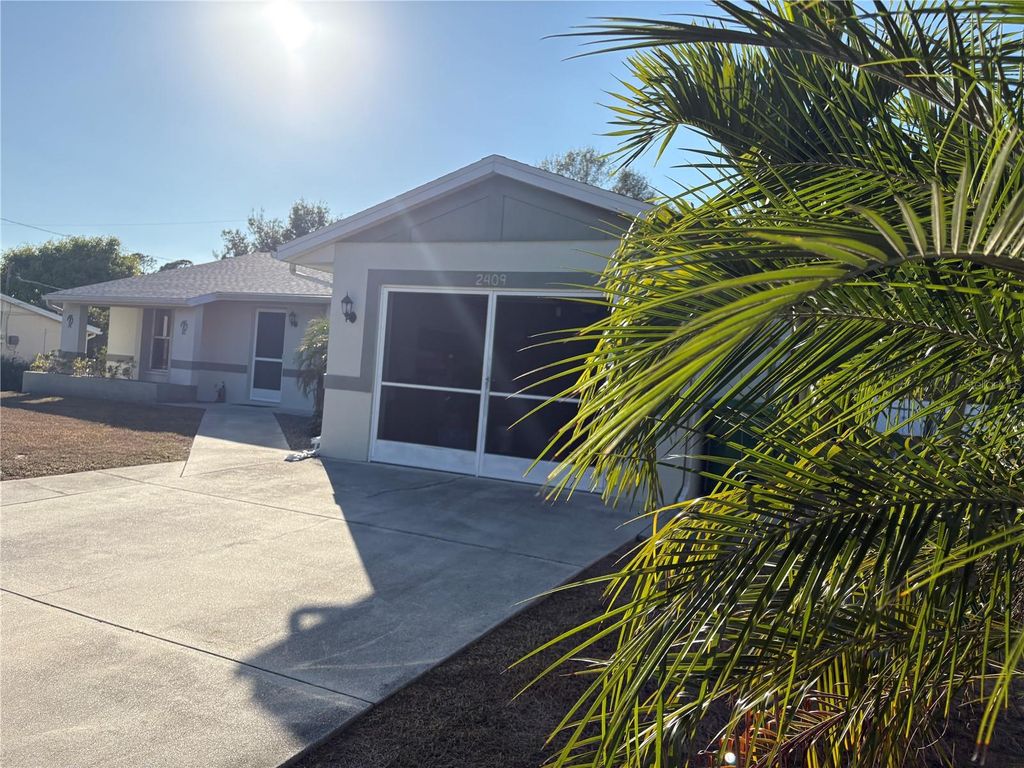 Photo of 2409 Dando Street, Port Charlotte, FL 33948 (MLS # C7518303)