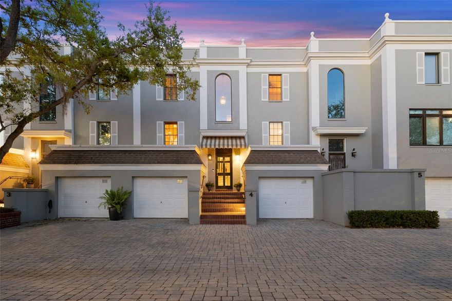 Positioned along Tampa’s iconic Bayshore Boulevard, this extraordinary waterfront residence offers timeless elegance paired with breathtaking bayfront scenery. Welcome to 5010 Bayshore Blvd, Unit 4—an exceptional three-story home where sweeping sunset views across the bay meet the sparkling lights of the downtown Tampa skyline.

Spanning just under 3,400 square feet of beautifully designed living space, the residence features three spacious bedrooms, a den, and four full bathrooms, offering both comfort and flexibility for refined everyday living. Warm hardwood floors flow throughout the home, creating a seamless and sophisticated feel across each level.

At the center of the home is a gourmet kitchen thoughtfully designed for both entertaining and everyday enjoyment. Outfitted with premium Miele appliances, including a built-in espresso machine and ice maker, the space is complemented by gorgeous cabinetry and elegant granite countertops that blend style with function.

Two wood-burning fireplaces—one in the family room and another in the den—create inviting spaces to relax while taking in the tranquil waterfront setting. Expansive windows and multiple outdoor spaces highlight the home’s remarkable location, including a serene patio overlooking the water and a screened terrace that provides the perfect setting to watch dolphins pass by as the sun sets over the bay.

The lower level offers an ideal recreation space for entertaining, gathering with friends, or enjoying games while overlooking the scenery. A private elevator services all three floors, and the home also includes a two-car garage and a brand new AC unit for added comfort and convenience. Residents enjoy access to a community pool and the unmatched lifestyle of living directly on Bayshore Boulevard, where evening walks along the waterfront and some of Tampa’s best dining are just moments from your front door.

This is a rare opportunity to experience elegant waterfront living in one of Tampa’s most coveted locations.