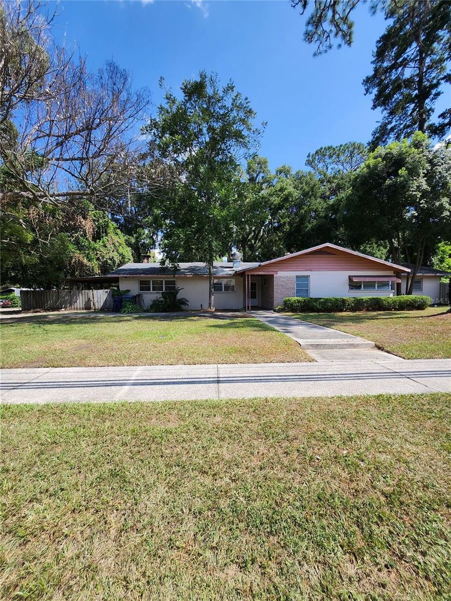 Looking for a diamond in the rough?  This property is zoned RES/OFF and has tons of potential.  Located on NW 140th Street near downtown Alachua, and is on over 1/2 acre (.69), backing to Alachua Elementary School.  Re-plumbing, 2 new water heaters and the roof were all completed in 2019.  Per City of Alachua, making this large home into a duplex and dividing the lot into 2 separate parcels (both must have a minimum of 10,000') is also an option.  **Owner is willing to hold a mortgage for the right buyer**