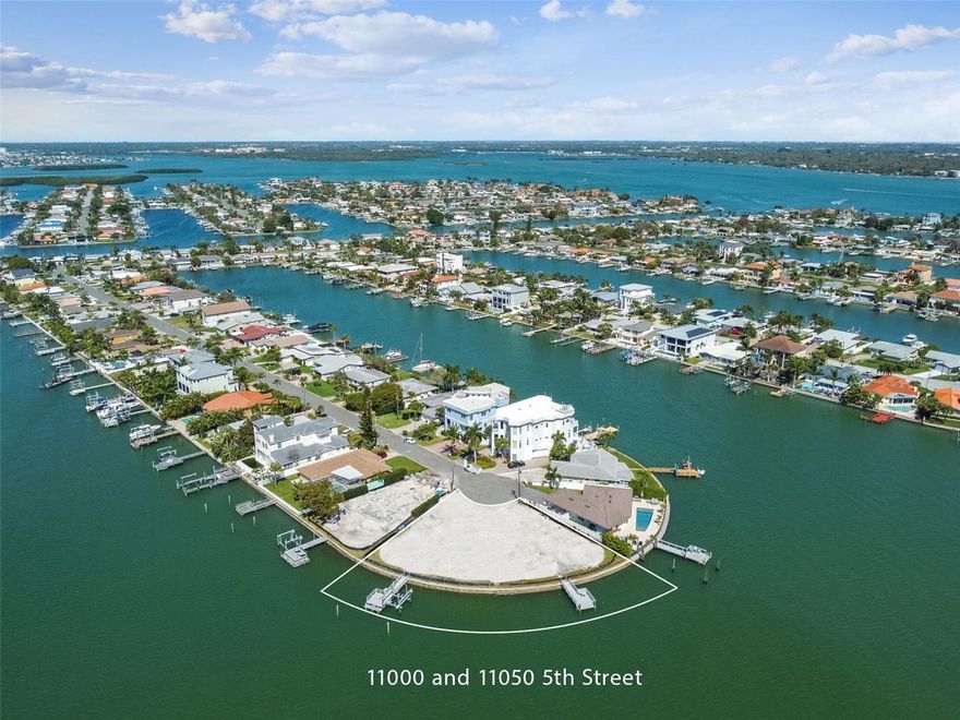 A truly rare offering in the highly coveted Isle of Palms neighborhood, this exceptional double bayfront homesite presents a once-in-a-lifetime opportunity to create a custom waterfront estate in one of Treasure Island’s most desirable locations.

Spanning approximately 0.36 acres, this oversized corner lot boasts an impressive 208 feet of seawall, delivering some of the widest, most unobstructed open water views available. With sweeping western exposure across the Intracoastal Waterway, you’ll enjoy breathtaking panoramic vistas, vibrant sunsets, and daily encounters with Florida’s coastal wildlife.

Positioned on deep, protected water, this property is a boater’s dream. Featuring two existing docks and two boat slips, it offers direct, access to the Gulf, ideal for accommodating larger vessels or creating your own private boaters retreat.

Set at the end of a quiet cul-de-sac and surrounded by some newly built luxury homes, this high-value location offers both privacy and prestige. The beach is a little more than half a mile away, while shopping, dining, and everyday conveniences are just minutes from your doorstep. Enjoy effortless access to the best of coastal living, along with nearby attractions in downtown St. Petersburg and Tampa.

This unique property is the result of combining two separately acquired parcels (11000 & 11050 5th St E), now ready for development. Architectural renderings are already available, offering a vision for a stunning custom residence designed to maximize the expansive water views and exceptional setting.

Whether you’re a boating enthusiast, a luxury home builder, or a buyer seeking a true trophy property, this is an unparalleled opportunity to build your dream home in a premier waterfront location.
