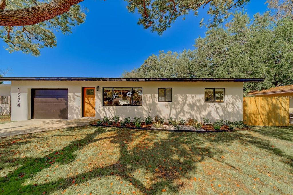 Photo of 1274 Robin Hood Lane, Dunedin, FL 34698 (MLS # TB8491431)