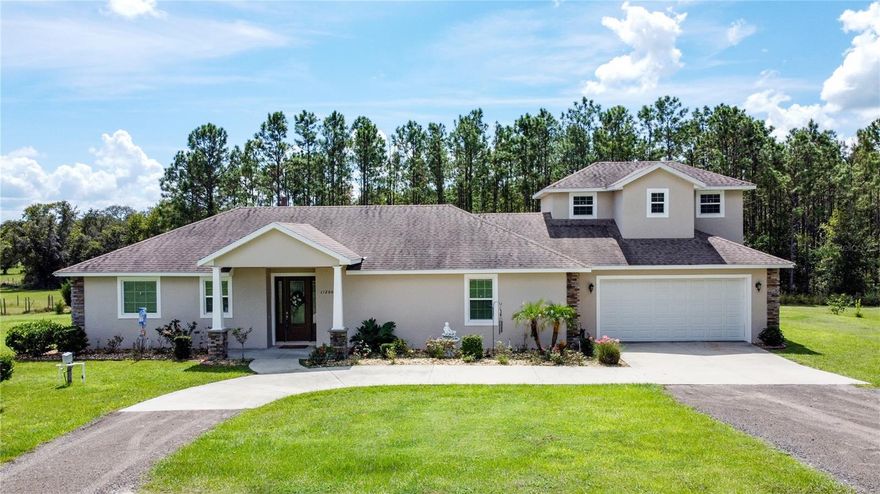 This 4 bedroom, 3.5 bath, pool home sits on 5 acres with NO HOA. If you are looking for Country life but close to city amenities this home is for you. Enjoy the spacious open floor plan featuring vaulted ceilings, dual gas fireplace, 2 primary suits and 8 foot doors throughout the main floor. The kitchen features stainless steel appliances, granite counter tops, walk in pantry & breakfast bar. The second floor has 2 bedrooms and a full bathroom. The main primary suite has tray ceilings, fireplace and 2 walk in closets. The bathroom has dual sinks, granite counters, linen closet, walk in shower & free standing garden tub. Detached 30x50 steel framed workshop with concrete floors and dual roll up doors make this ideal for storage, workshop or extra room for cars. Currently zoned AG, so bring your horses, cows et, property is fully fenced with 1 well & 2 septic systems.