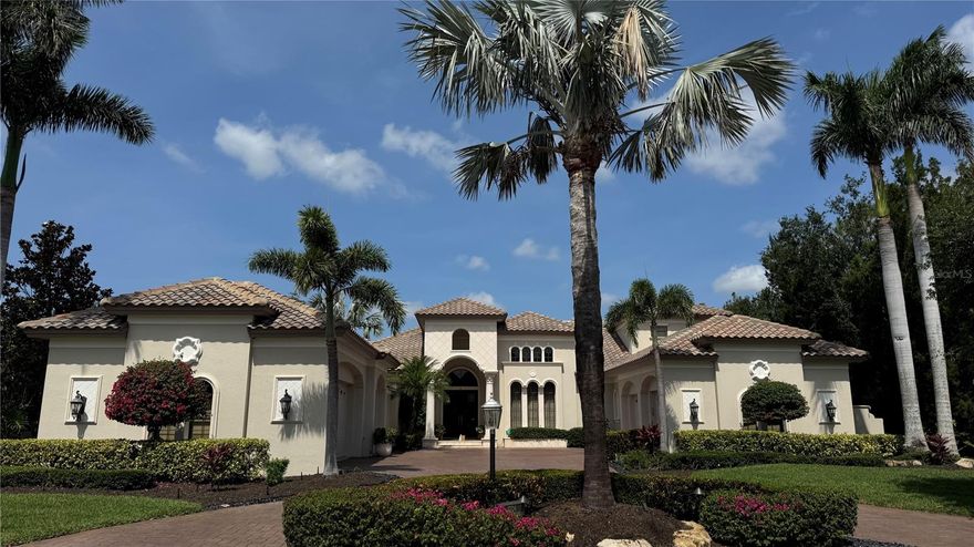 Exquisite Mediterranean Estate in Lakewood Ranch Country Club.  Nestled behind the gates of Lakewood Ranch Country Club, this magnificent Mediterranean-style estate offers a harmonious blend of luxury, comfort, and timeless elegance. Located in the exclusive Teal Creek neighborhood, the residence is surrounded by lush landscaping and serene golf course frontage, providing a tranquil retreat for discerning homeowners. As you approach the property, a circular paver driveway leads to an impressive façade adorned with arched double doors and wrought-iron accents. Inside, the grand living room welcomes you with soaring pecky cypress ceilings, travertine flooring, and a dual-sided fireplace, creating an inviting atmosphere for both relaxation and entertaining. The gourmet kitchen is a chef's dream, featuring high-end appliances, walk-in pantry, multiple workspaces, and ample storage. Rich textures and finishes invite guests to gather and enjoy culinary delights. Expansive glass sliders open to a stunning outdoor living area, where a paver lanai, updated summer kitchen, fireplace, and an expansive pool and spa await, all set against the backdrop of tranquil mature landscaping. The main-floor master suite is a sanctuary of luxury, showcasing hardwood floors and a spa-like bathroom. Two additional bedrooms are thoughtfully placed throughout the first floor, each boasting full en-suite bathrooms to ensure privacy and comfort for family and guests. Fourth bedroom is located on the second floor with easy access to the second floor lanai and bonus room. Situated on a generous half-acre lot, the property offers a perfect balance of indoor and outdoor living spaces. The five-car garage provides ample storage, while the meticulously maintained grounds reflect the home's commitment to quality and elegance. Live stress free with whole house generator and impact glass.  Located in the heart of Lakewood Ranch, residents enjoy access to top-rated schools, premier golf courses, and a vibrant community with a plethora of dining, shopping, and recreational options. This estate embodies the pinnacle of Florida luxury living, offering an unparalleled lifestyle in one of the state's most sought-after communities.