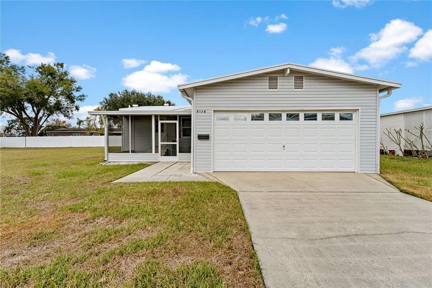 Located at 6136 Ridgeway in Zephyrhills, this well-cared-for 2 bedroom, 2 bathroom mobile home offers a rare combination of space, functionality, and freedom—with no HOA or CDD. A 2-car garage sets this home apart, providing ample room for vehicles, storage, or hobbies. The screened front porch adds usable outdoor living space and is a great spot to relax and enjoy Florida living year-round.

Inside, the layout is practical and comfortable with inside laundry and well-defined living spaces that make everyday living easy. Major updates have already been completed, including a roof replaced approximately two years ago and newer windows installed by the previous owner, helping reduce future maintenance concerns. The home is also equipped with a Generac generator and propane tank, offering added peace of mind during storm season or power outages.

The location is another strong advantage. You’re just minutes from downtown Zephyrhills, with convenient access to shopping, restaurants, and everyday essentials. Whether you’re looking for a primary residence, a seasonal home, or a property with flexibility and fewer restrictions, this home delivers solid value, key upgrades, and a location that keeps you close to everything Zephyrhills has to offer.