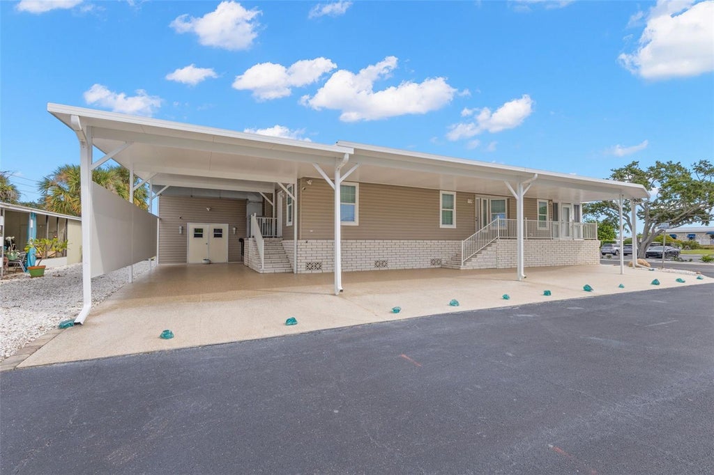 Photo of 7300 Americana Drive NE #143, St Petersburg, FL 33702 (MLS # TB8553983)
