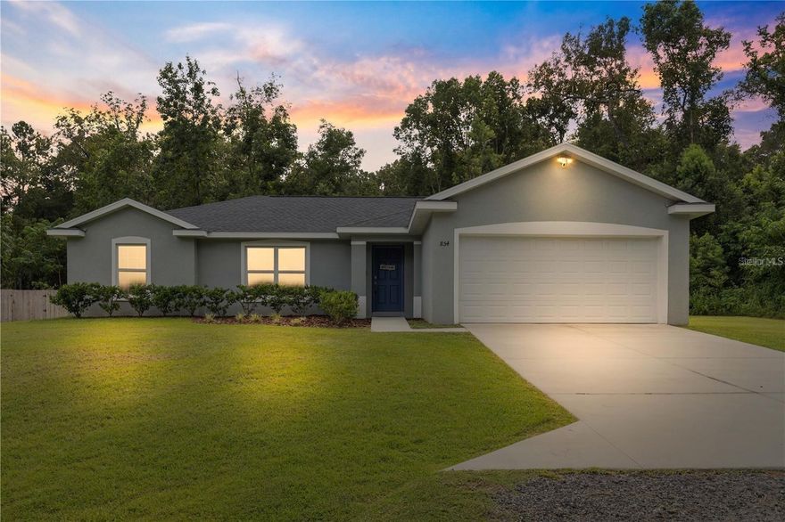 This three-bedroom, two-bathroom home, constructed in 2022, showcases an open floor plan with tile flooring throughout. The kitchen is designed with an abundance of cabinetry for generous storage space, complemented by soft-close cabinet doors. Both bathrooms boast fully tiled showers, and the home also features a separate laundry room for added convenience. This home is situated in the heart of Ocala, putting you close to everything—shopping, dining, parks, and schools—making it a prime location for convenience and lifestyle. Don't miss this opportunity to own a move-in-ready home in one of Ocala’s most desirable areas!