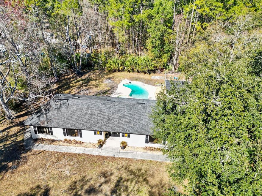 This fully renovated brick home offers space, privacy, and flexibility that’s increasingly difficult to find inside the city. With nearly 40,000 sq ft of land, there’s room for your RV, boat, workshop, future expansion, or simply the freedom to enjoy wide-open outdoor living without restrictive HOA rules.
Inside, the home has been thoughtfully updated with modern finishes throughout, including a renovated kitchen, upgraded bathrooms, porcelain tile flooring, and fresh interior improvements. Major systems have been addressed for peace of mind, featuring a newer roof, updated HVAC system, new ductwork, and public water connection.
Step outside to your private pool and expansive backyard — perfect for entertaining, relaxing, or creating your own outdoor oasis. The oversized lot provides true privacy and long-term versatility rarely available at this price point.
Conveniently located with easy access to major roads, shopping, and daily amenities, this property combines land, location, and move-in readiness — an increasingly rare lifestyle opportunity in Jacksonville.