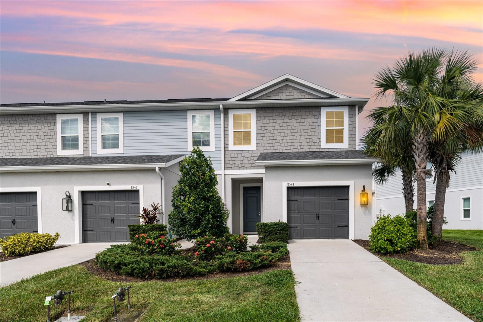 Don’t miss your chance to own a Rarely Available End-Unit Townhome with a larger lot and Water View in North River Ranch!
Why wait to build when you can move right into this stunning, like-new end-unit townhome overlooking a serene pond. Thoughtfully designed, this home blends style, comfort, and functionality in one perfect package.
Inside, the open-concept floor plan is enhanced by an extra side window, filling the living area with natural light. The modern kitchen is a true highlight, featuring gray cabinetry, sleek granite countertops, stainless steel appliances, and a spacious island—perfect for cooking, entertaining, or casual dining. The living room flows seamlessly to the screened lanai, where you can relax and enjoy peaceful water views—a private retreat right at home.
Upstairs, the split-bedroom layout offers privacy and flexibility. The primary suite boasts two walk-in closets and a spa-like en-suite bath, while two additional bedrooms share a full bath. The convenience of an upstairs laundry room makes daily living effortless. Plus, the impact glass windows on the top floor provide storm protection without the need for hurricane shutters.
North River Ranch offers a gated, maintenance-free lifestyle with unmatched resort-style amenities: multiple pools, a fitness center, outdoor fitness stations, scenic biking and walking trails, playgrounds, soccer fields, pickleball courts, fire pits, game stations, a BMX track, and year-round community events. With a brand-new Publix walking distance and more shopping, dining, medical facilities, and schools coming soon, everything you need is right at your fingertips—just a short walk or golf cart ride away.
This is the one you’ve been waiting for—schedule your private showing today!
