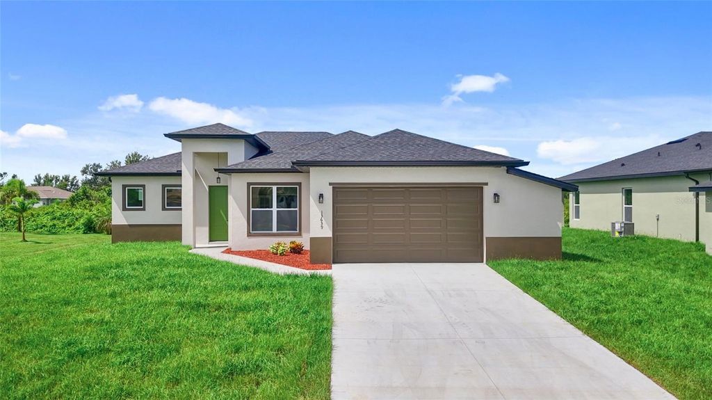 Photo of 13639 Begonia Circle, Port Charlotte, FL 33981 (MLS # O6333389)