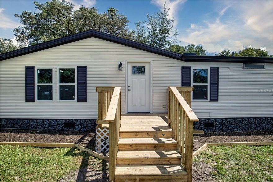 Take a tour of this stunning 4-bedroom 2-bathroom house located in the desirable Lake Weir Shores neighborhood! Nestled on a family-friendly street, you will find this immaculate home newly renovated from top to bottom, featuring all the bells and whistles you've been searching for. The long list of brand-new renovations includes a roof, AC, septic, plumbing, flooring, kitchen, bathrooms, drywall, doors and windows - and every inch is brand-new and waiting for you. Fall in love with this peaceful paradise and make it your own - with 1782 Sq.ft. of blissful living space, don't wait on this extraordinary opportunity any longer!