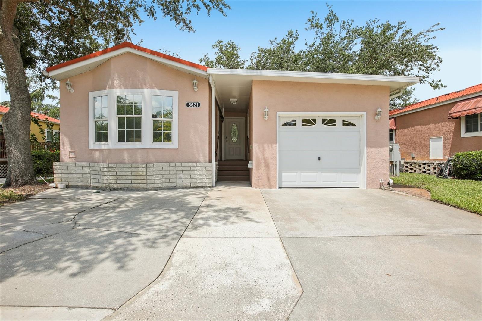 LAKEFRONT! LEASE TO OWN OPTION! Unique and a hard find waterfront Casita with a garage is located on Lake Bonito in the Casita Village at the exclusive, clothing optional, Caliente Resort. The bedroom has a bay window, pocket door, built in drawers and 2 closets with mirrored closet doors, and a ceiling fan. Main bathroom has been completely remodeled w/ faux stone shower, built in corner shelves, hand bar, and clear glass shower doors w/ bronze framework. Bathroom has a large linen closet with mirror sliding doors. Featuring a climate-controlled 14'x16' garage with a NEW mini split AC, insulated drywall, energy-efficient thermal pane glass windows, and keyless entry. Smart LED Illuminated Mirror Medicine Cabinet and smart bidet toilets in bathrooms. NEW LG washer and dryer! Crown molding and vaulted ceilings. Kitchen offers upgraded maple cabinetry and stainless steel appliances: LG Energy Star refrigerator w/ ice maker, LG microwave/convection oven, a five-burner double convection oven, and Frigidaire dishwasher. The dining, living room and the west facing Florida room overlook the lake and are perfect for colorful sunset views and can be used as a living room. The Living Room was and can be used as a second bedroom with an optional self standing closet. Garage with AC, separate entrance, bathroom and optional closet can also be converted into an in-law unit or 3rd bedroom if needed. Purchase this home and start enjoying the vast amenities this clothing optional resort has to offer, plus the fun activities Caliente has coordinated for you. Membership to the resort is mandatory. Lease to own and seller financing available. Do NOT wait, it will not last long!