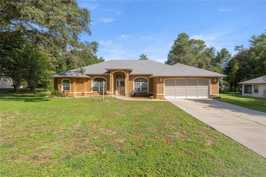 Photo of 10716 SW 53rd Circle, Ocala, FL 34476 (MLS # OM728010)