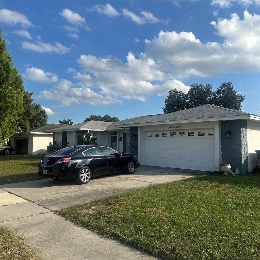 Photo of 7100 Scruboak Lane, Orlando, FL 32818 (MLS # O6374356)
