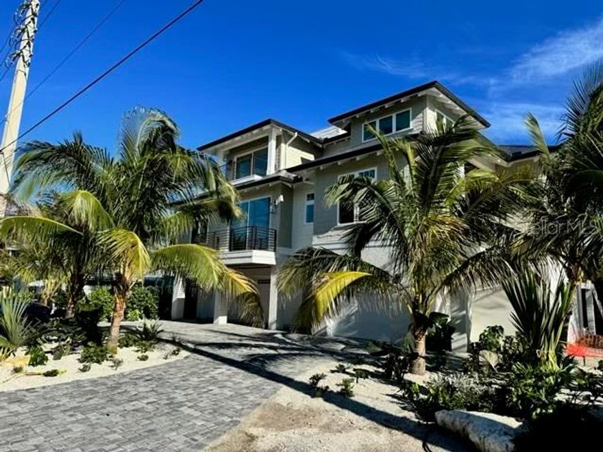 Stunning new construction build on Anna Maria Island!  2 blocks from the white sandy beaches of the Gulf of Mexico. No expense was spared on this gorgeous 4 bedroom 5 bath contemporary beach home. Made for entertaining with open concept living and gourmet kitchen complete with high end appliances and finishes throughout. Thoughtful floor plan with multiple places to relax inside, poolside or take the party to your roof top deck for sunset. Spacious in every sense making this the perfect second home or investment property.